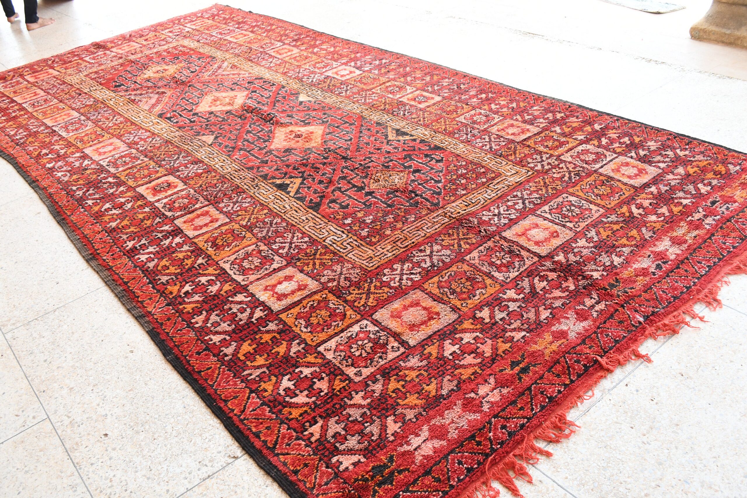 a red rug with a pattern on it. il_fullxfull.6076142363_sl3s.jpg