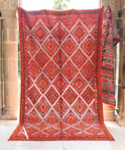 a red rug is on display in a room. il_fullxfull.6076149535_rn1p.jpg