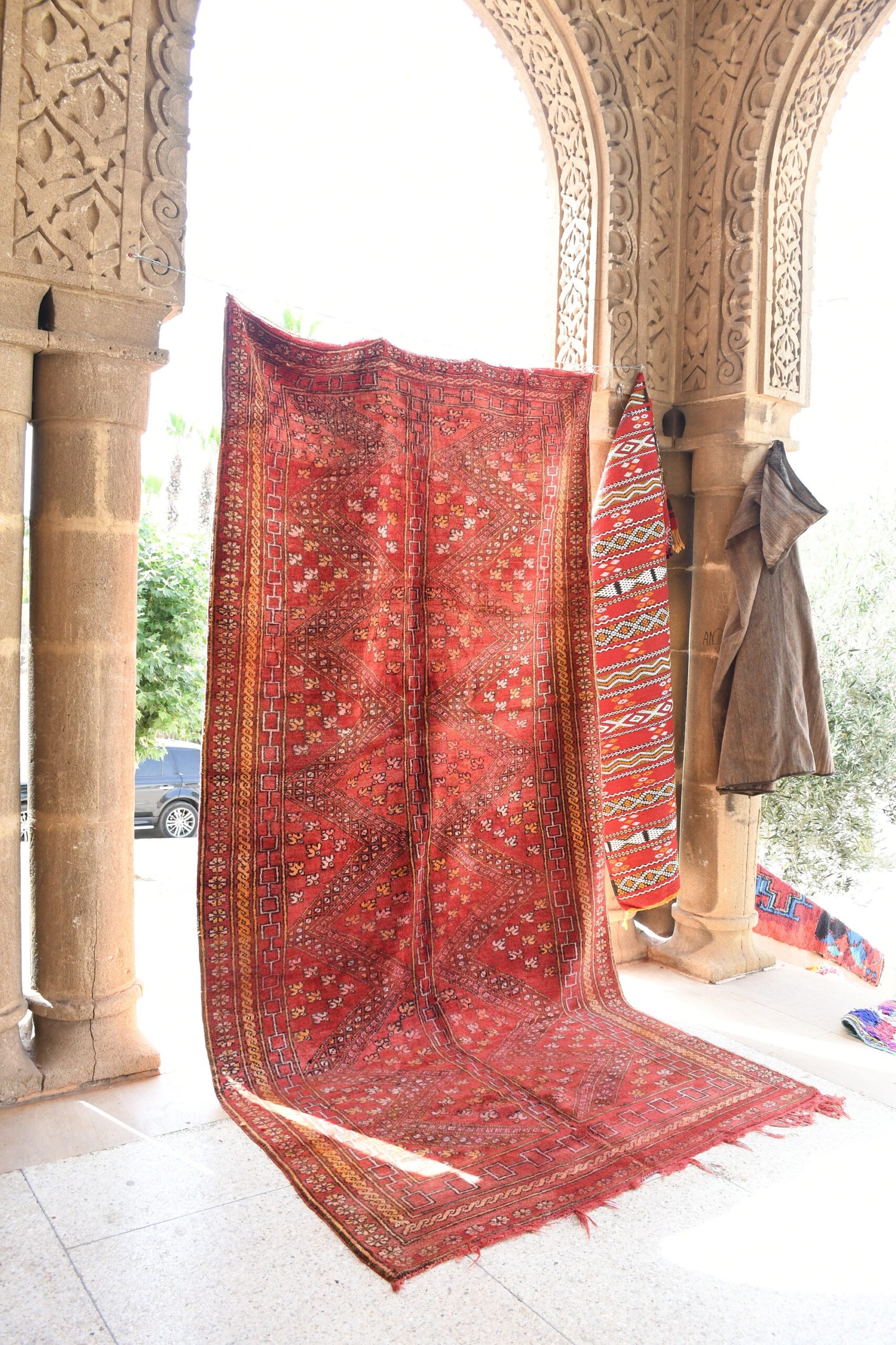 a red rug hanging on a wall. il_fullxfull.6076153307_79nn.jpg