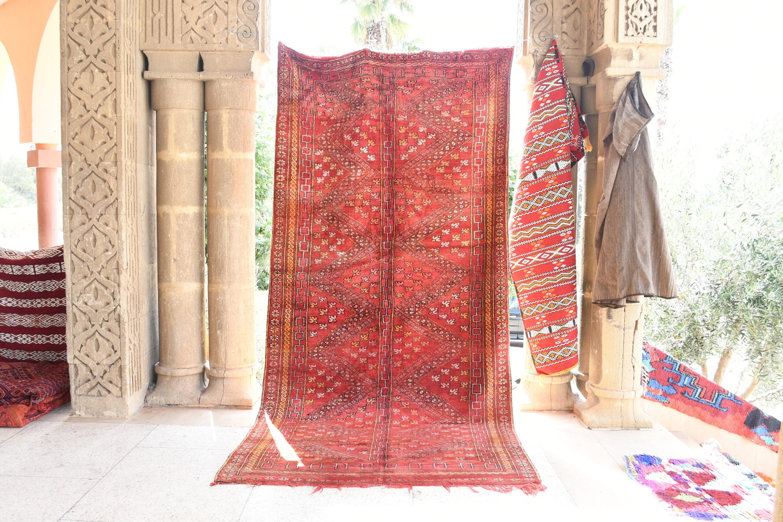 a red rug hanging on a wall. il_fullxfull.6076153765_j91m.jpg