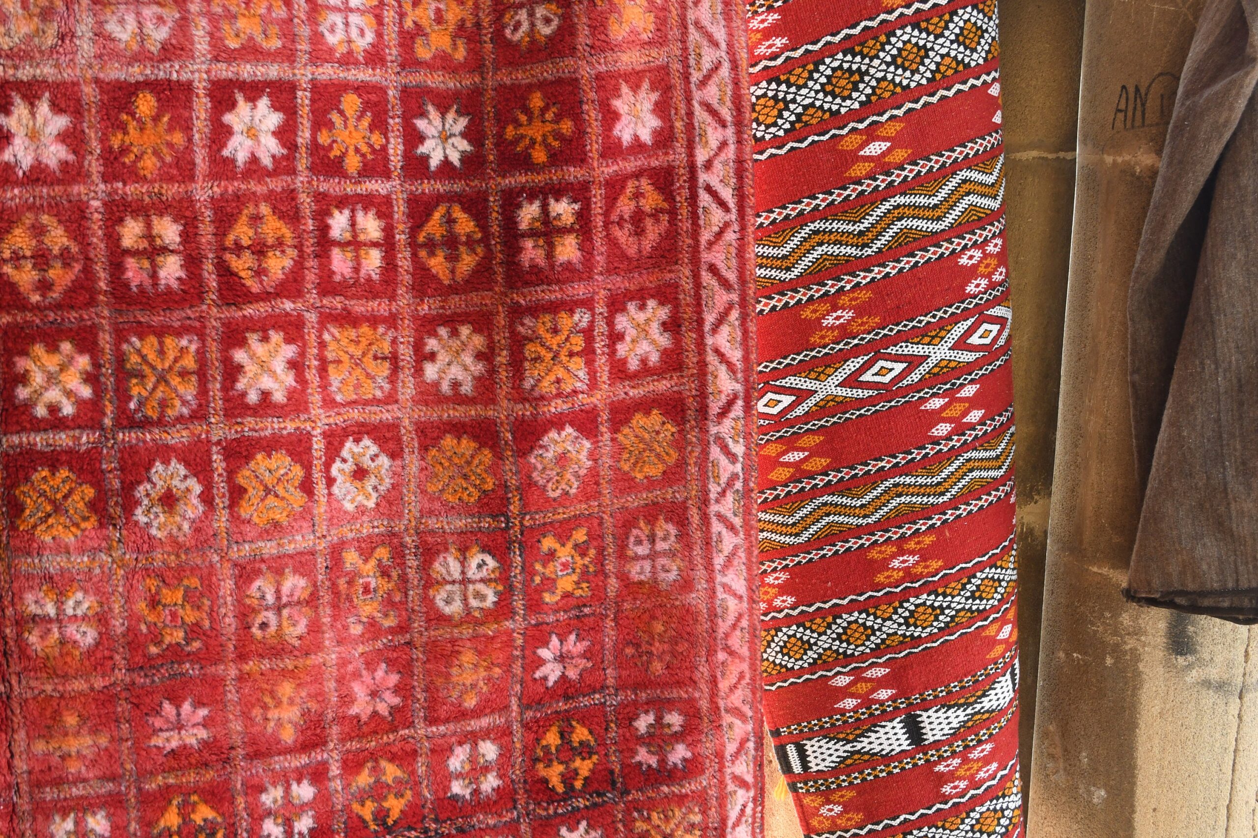 a red rug hanging on a wooden pole. il_fullxfull.6076156001_99s8.jpg