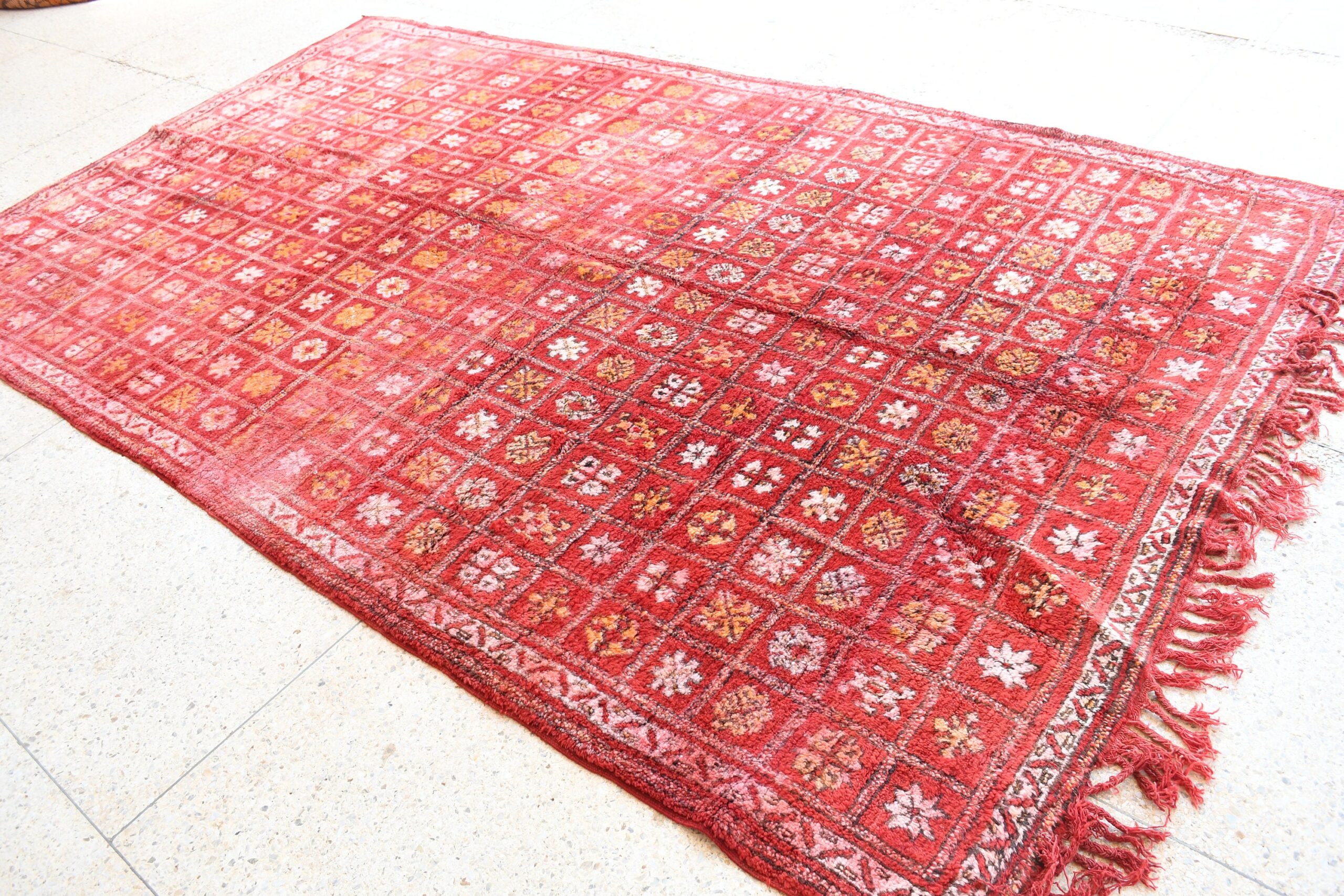 a red rug with a pattern on it. il_fullxfull.6076156691_f1c7.jpg