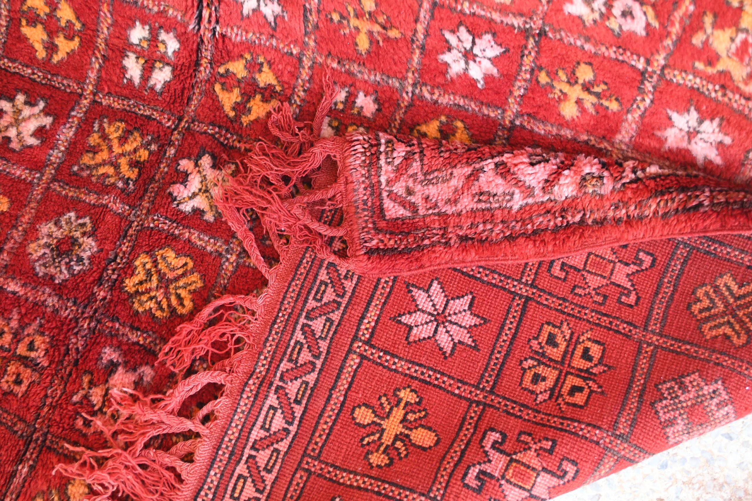 a red rug with a pattern on it. il_fullxfull.6076156829_lmoj.jpg