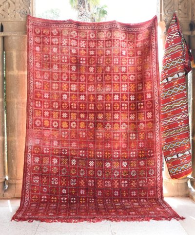 a red rug hanging on a wall. il_fullxfull.6076157001_eym0.jpg