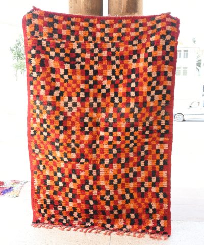 a red and black quilt hanging on a pole. il_fullxfull.6076158609_e1gv.jpg