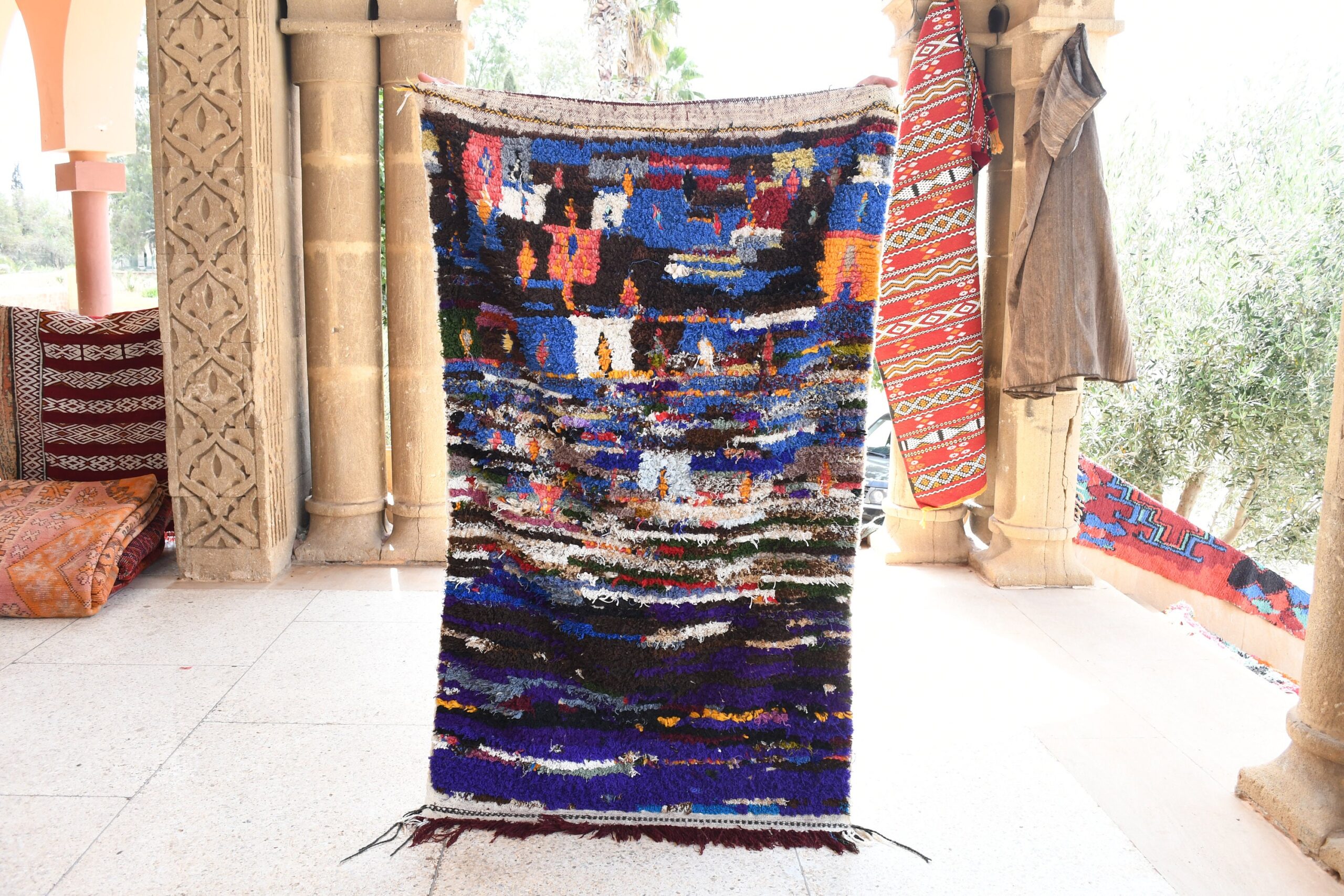 a colorful rug hanging on a wall. il_fullxfull.6076163427_tgik.jpg