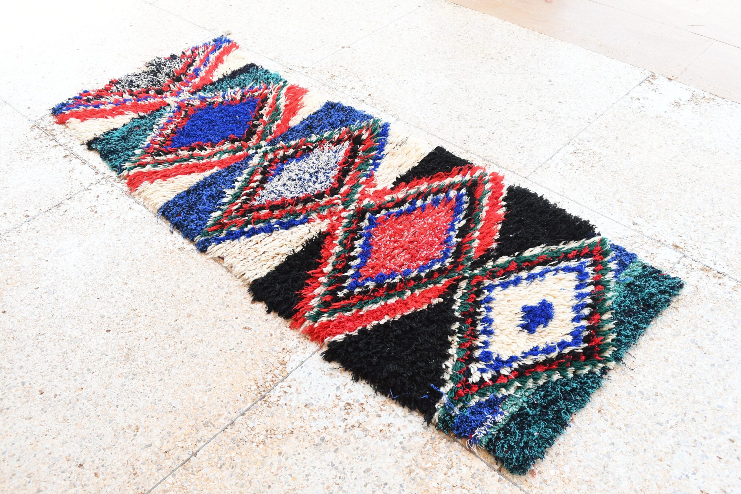 a colorful rug on the floor. il_fullxfull.6076168935_5s2l.jpg