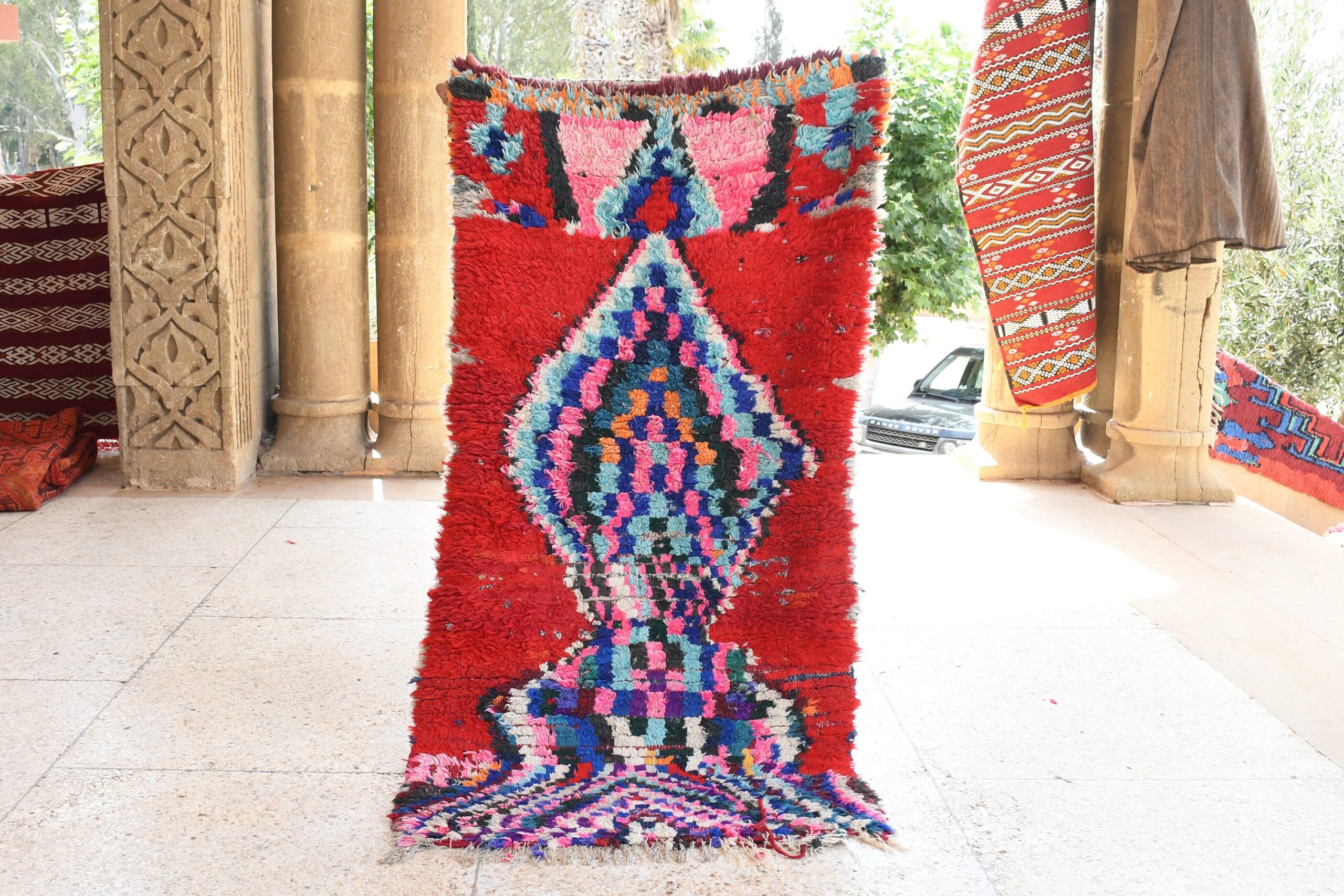 a red carpet with a colorful pattern on it. il_fullxfull.6076170783_72uy.jpg