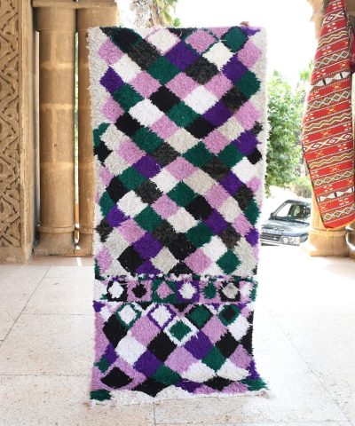 a colorful rug is on display in a room. il_fullxfull.6076173381_bsdr.jpg