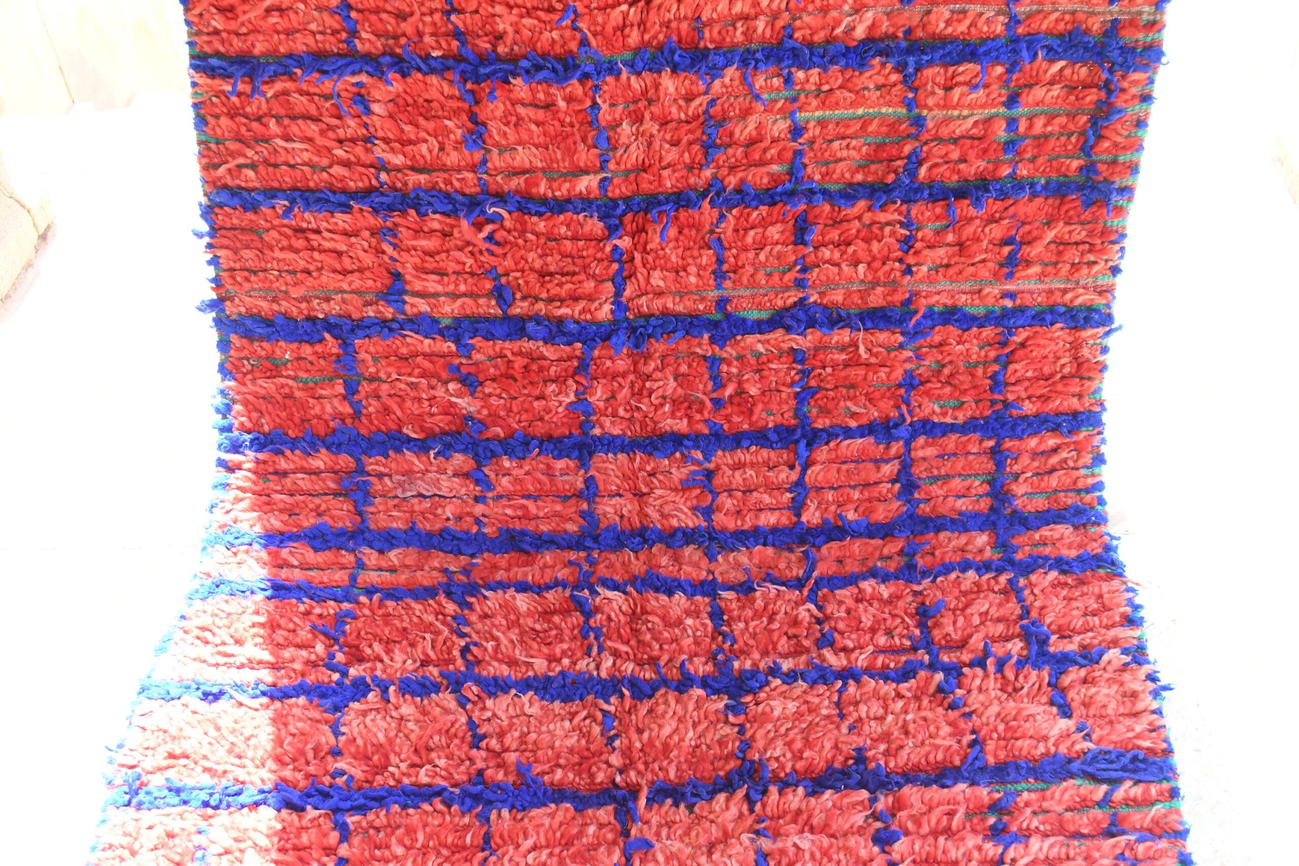 a red and blue rug with fringes. il_fullxfull.6076178243_emqk.jpg