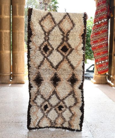 a rug is on display in a room. il_fullxfull.6076185335_j9du.jpg