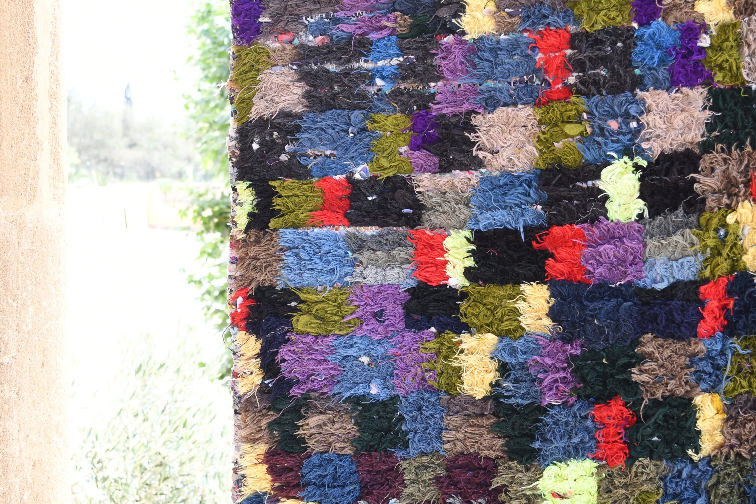 a colorful rug is hanging on a wall. il_fullxfull.6076187321_2vna.jpg