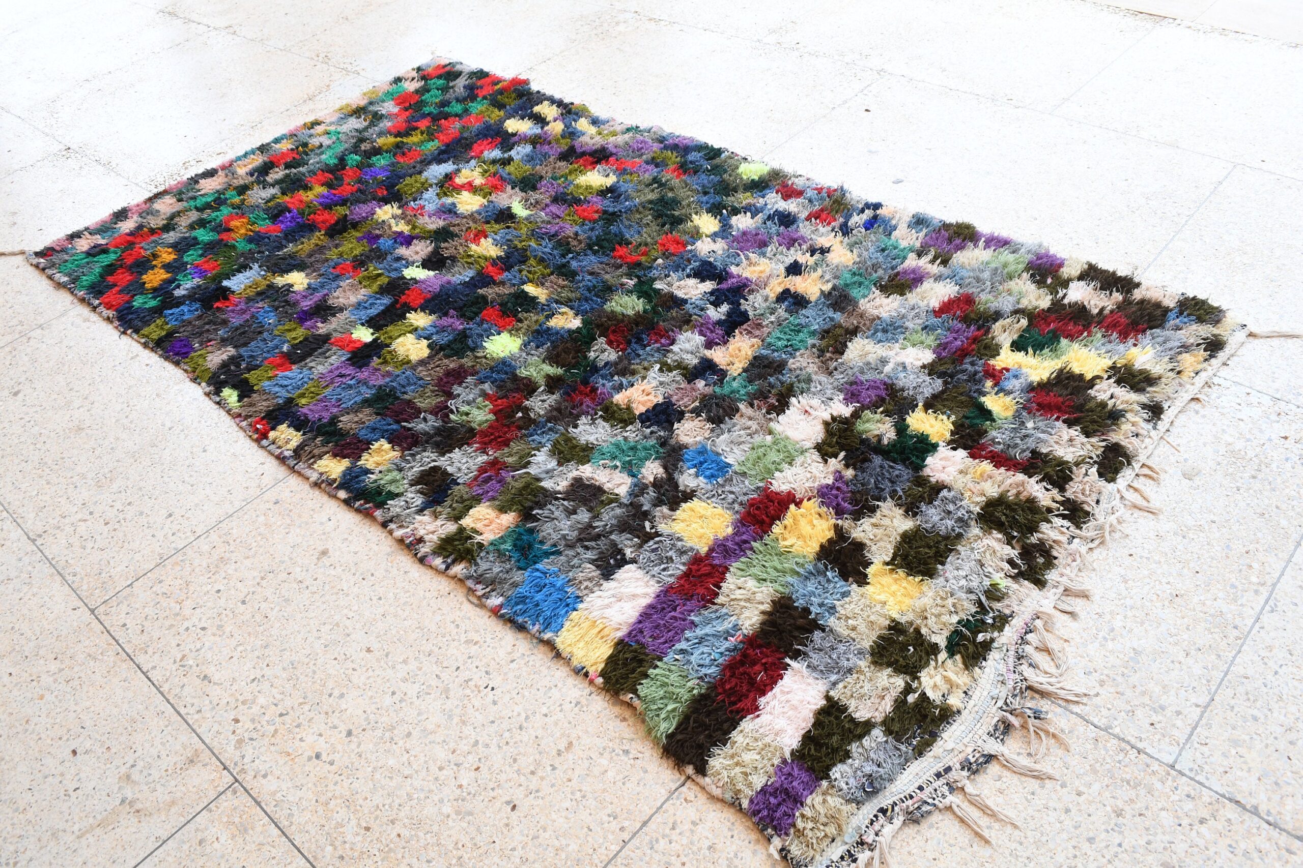 a multi colored rug on the floor. il_fullxfull.6076189735_odr3.jpg