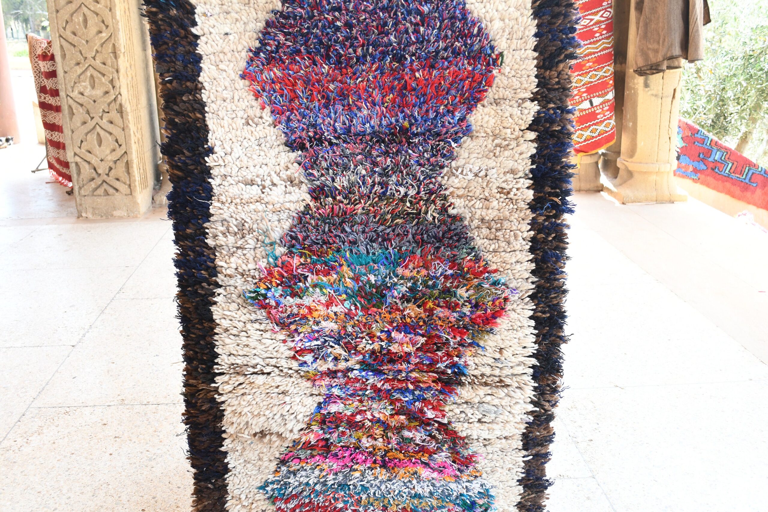 a large pile of colorful rugs. il_fullxfull.6076194731_n9o9.jpg