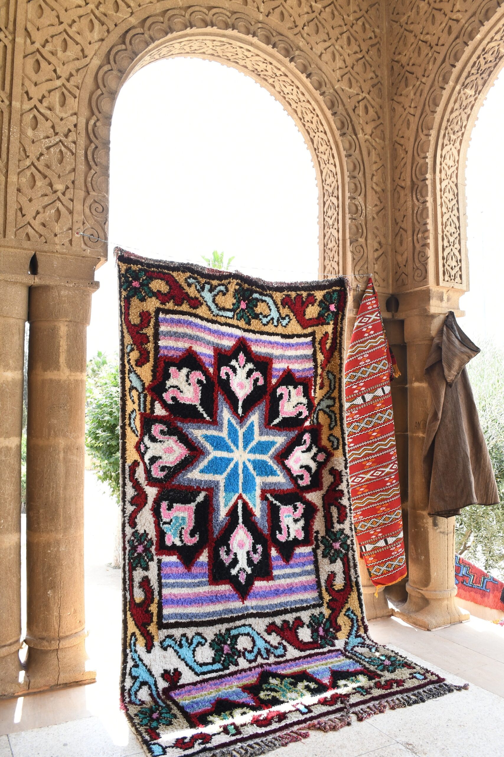 a colorful rug on a porch. il_fullxfull.6076272611_lrfp.jpg