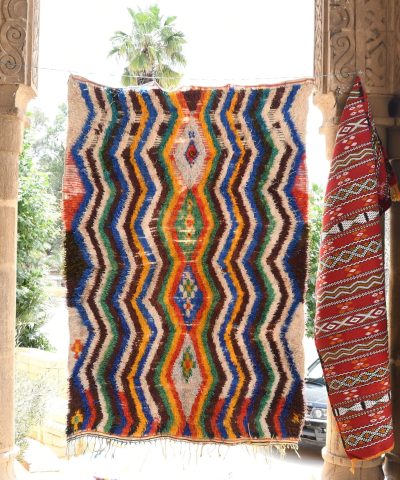a colorful rug hanging on a wall. il_fullxfull.6076274659_kprh.jpg