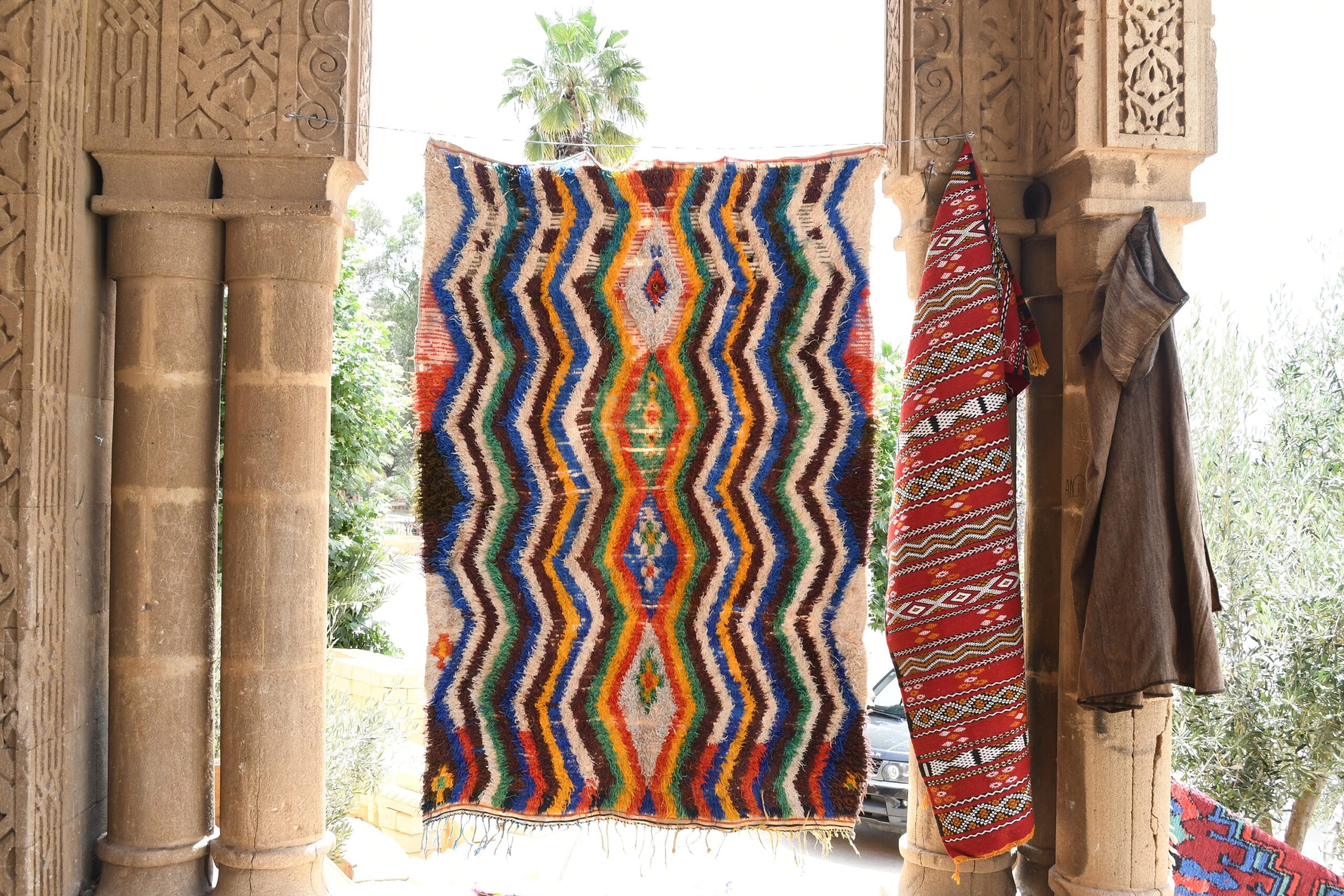 a colorful rug hanging on a wall. il_fullxfull.6076274659_kprh.jpg