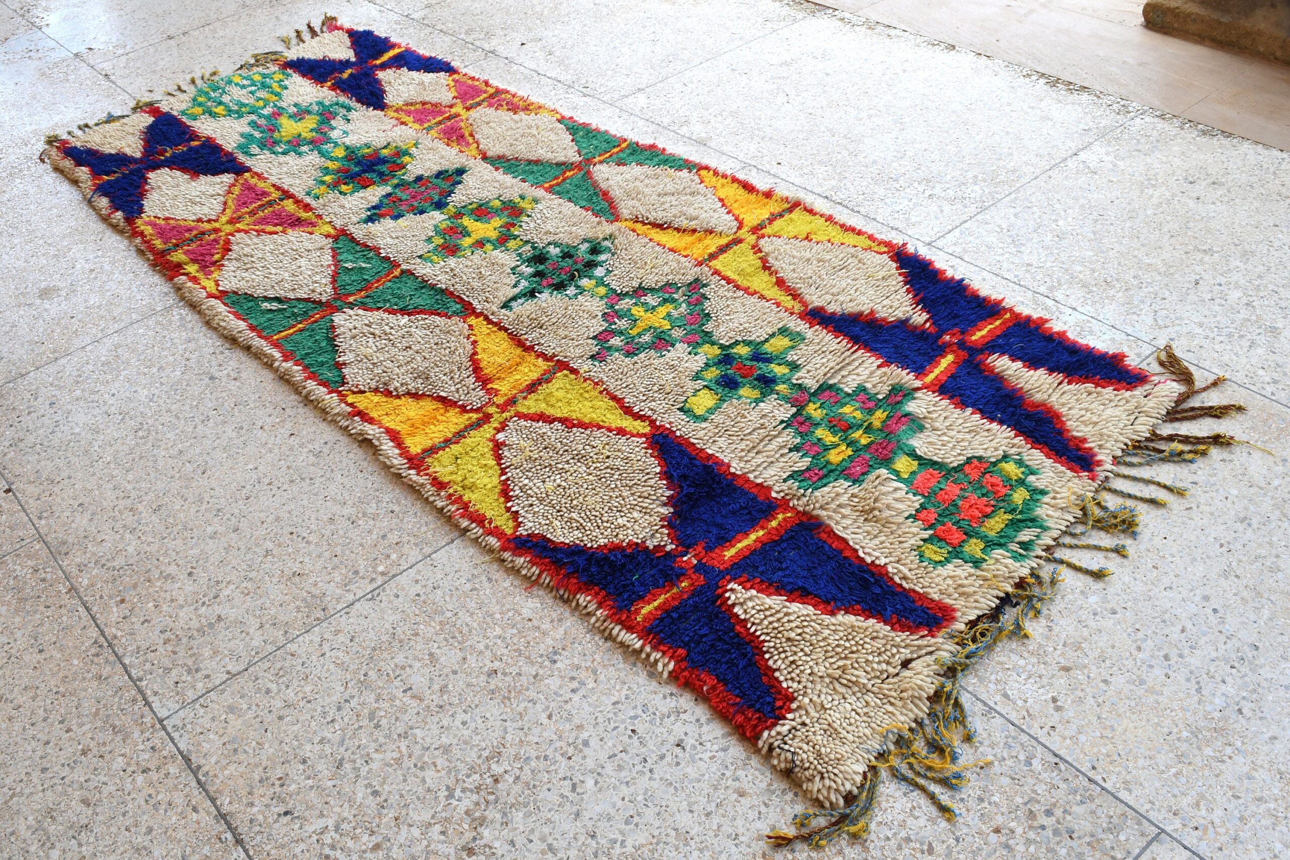 a colorful rug on the floor. il_fullxfull.6076275965_38bi.jpg