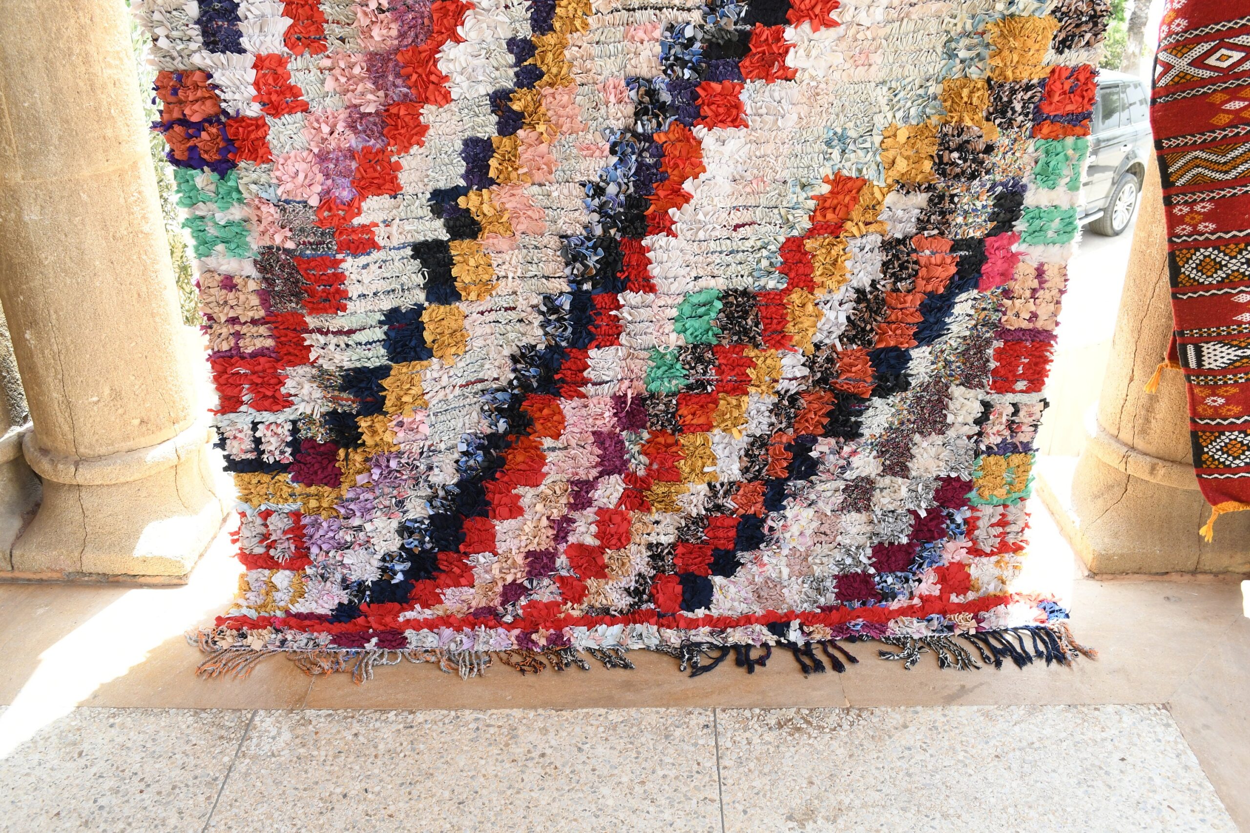 a rug is on display in a room. il_fullxfull.6076280017_9c4v.jpg