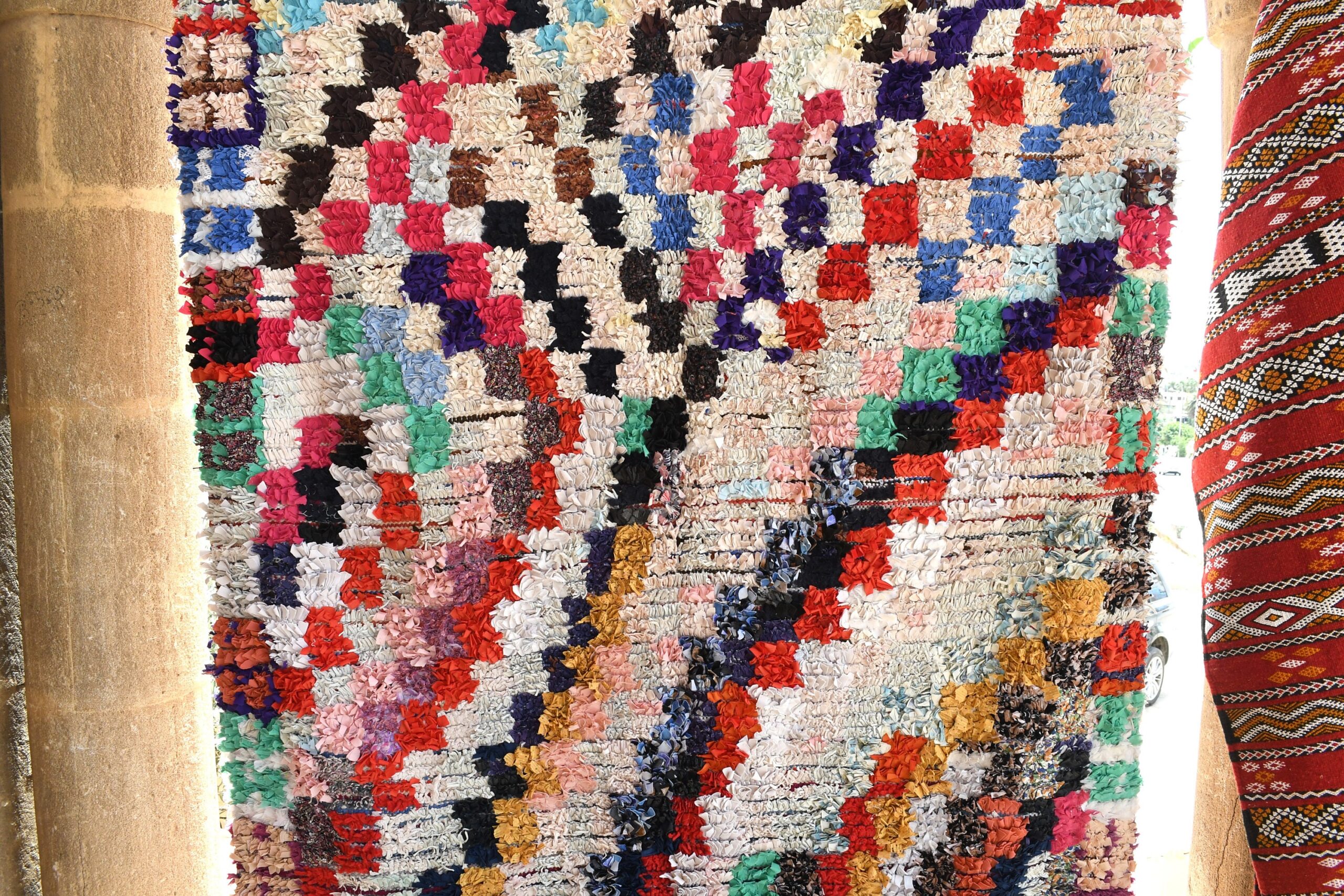 a colorful rug hanging on a wall. il_fullxfull.6076280257_tk9b.jpg