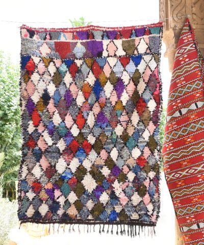 a colorful rug hanging on a wall. il_fullxfull.6076288943_t2b0.jpg