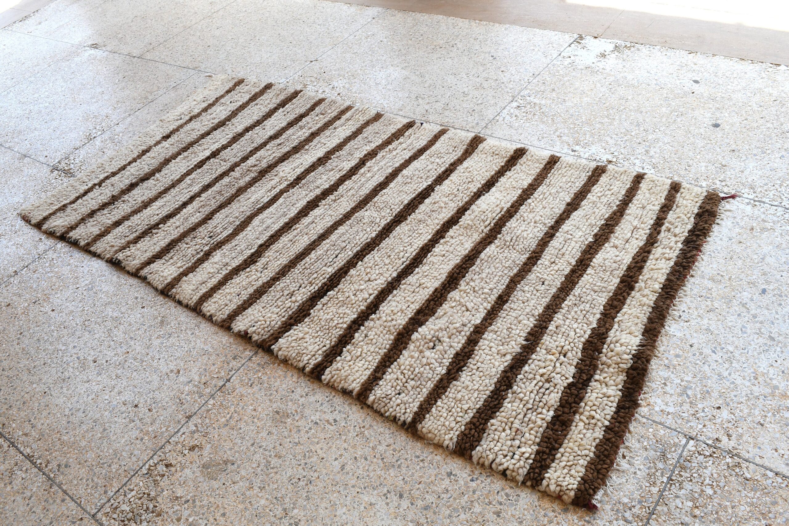 a rug with a striped pattern on it. il_fullxfull.6076294757_lc8z.jpg