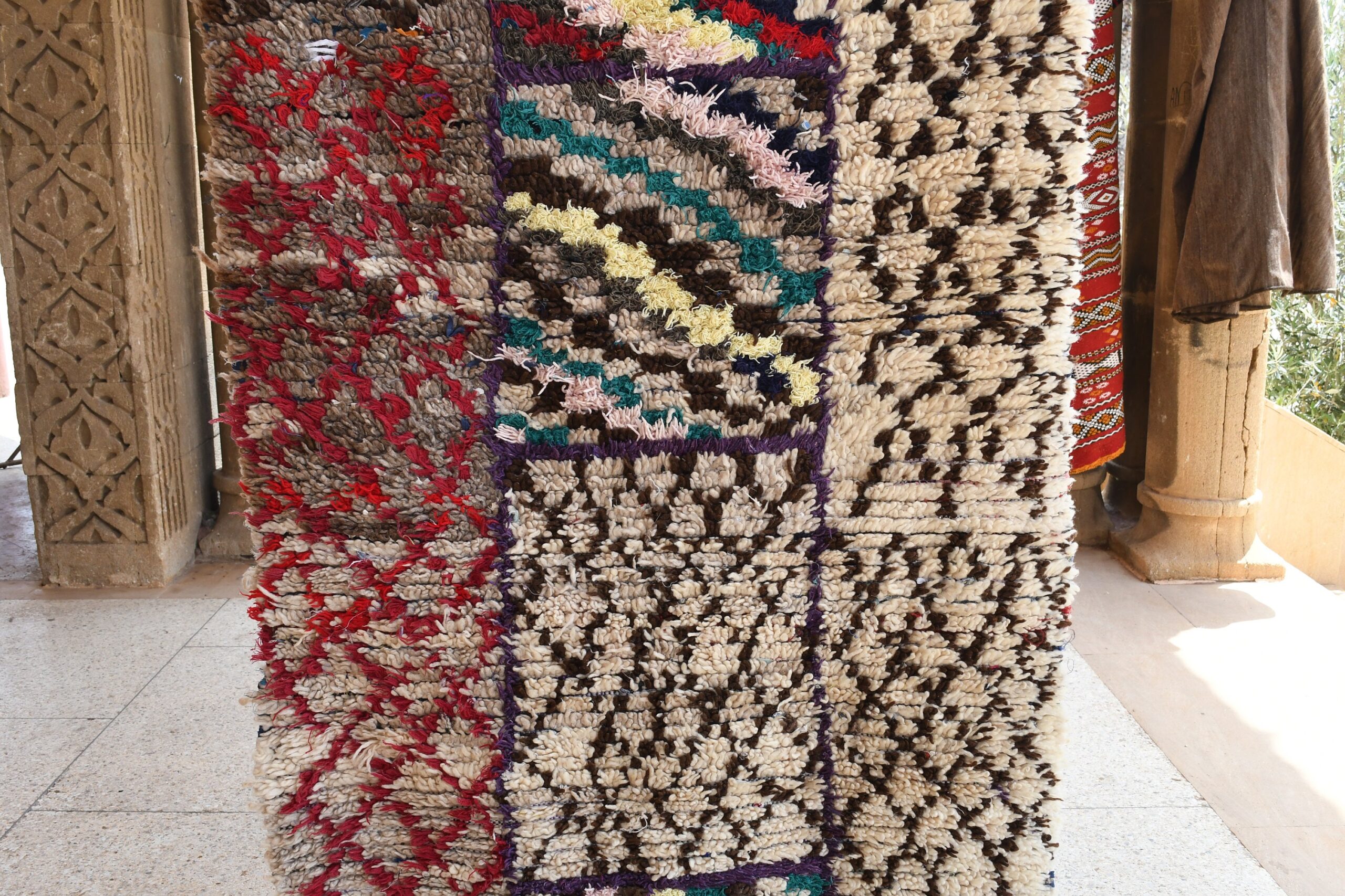 a pile of rugs on display in a room. il_fullxfull.6076296227_mtgt.jpg