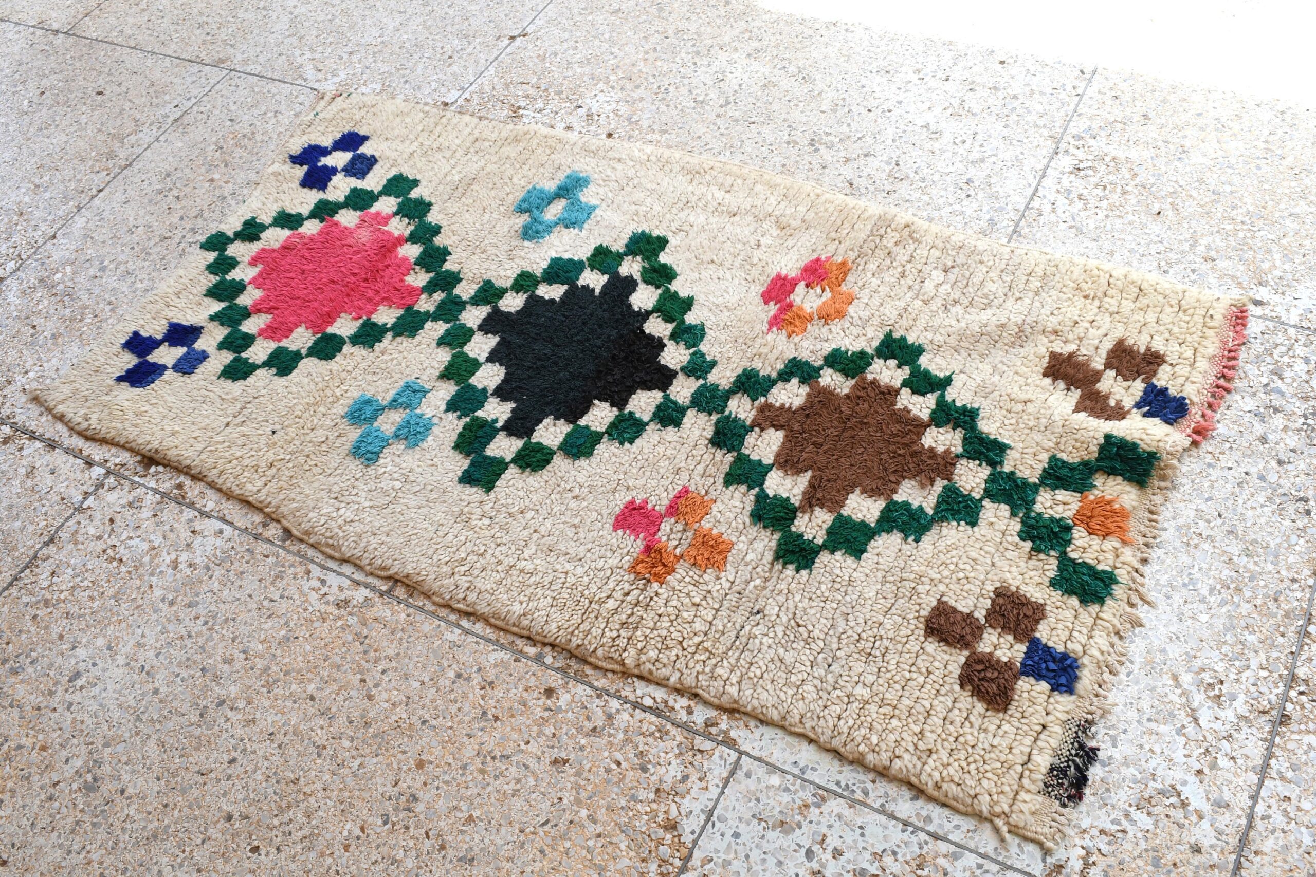 a rug with a pattern of flowers on it. il_fullxfull.6076304203_r6tz.jpg