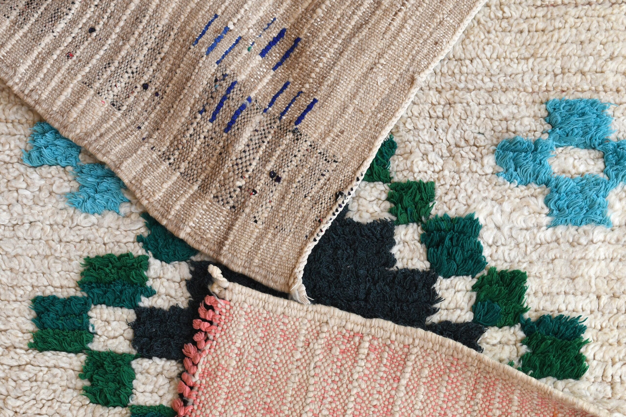 a pile of rugs with different colored patterns. il_fullxfull.6076304315_i6v9.jpg