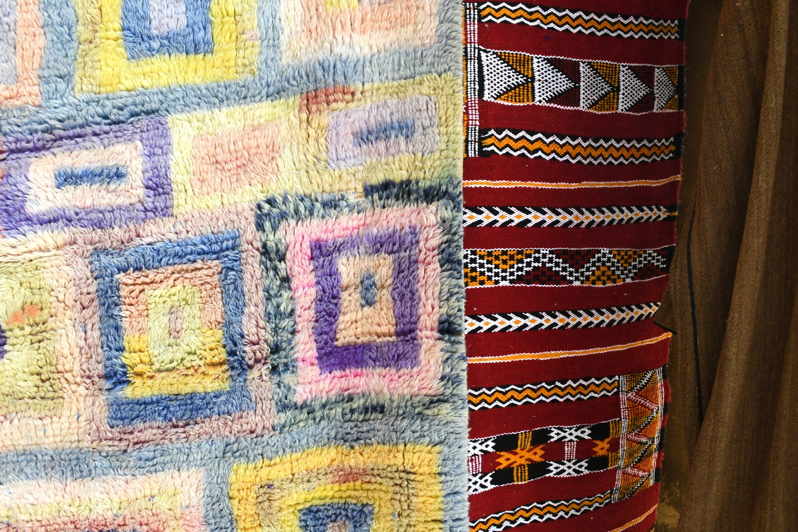 a colorful rug on a wooden wall. il_fullxfull.6083089509_8wpv.jpg