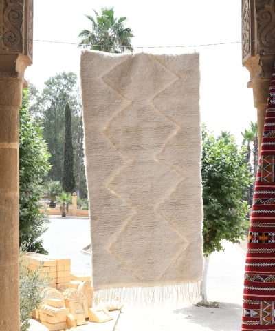 a red and white moroccan rug hanging on a wall. il_fullxfull.6083092803_sst1.jpg