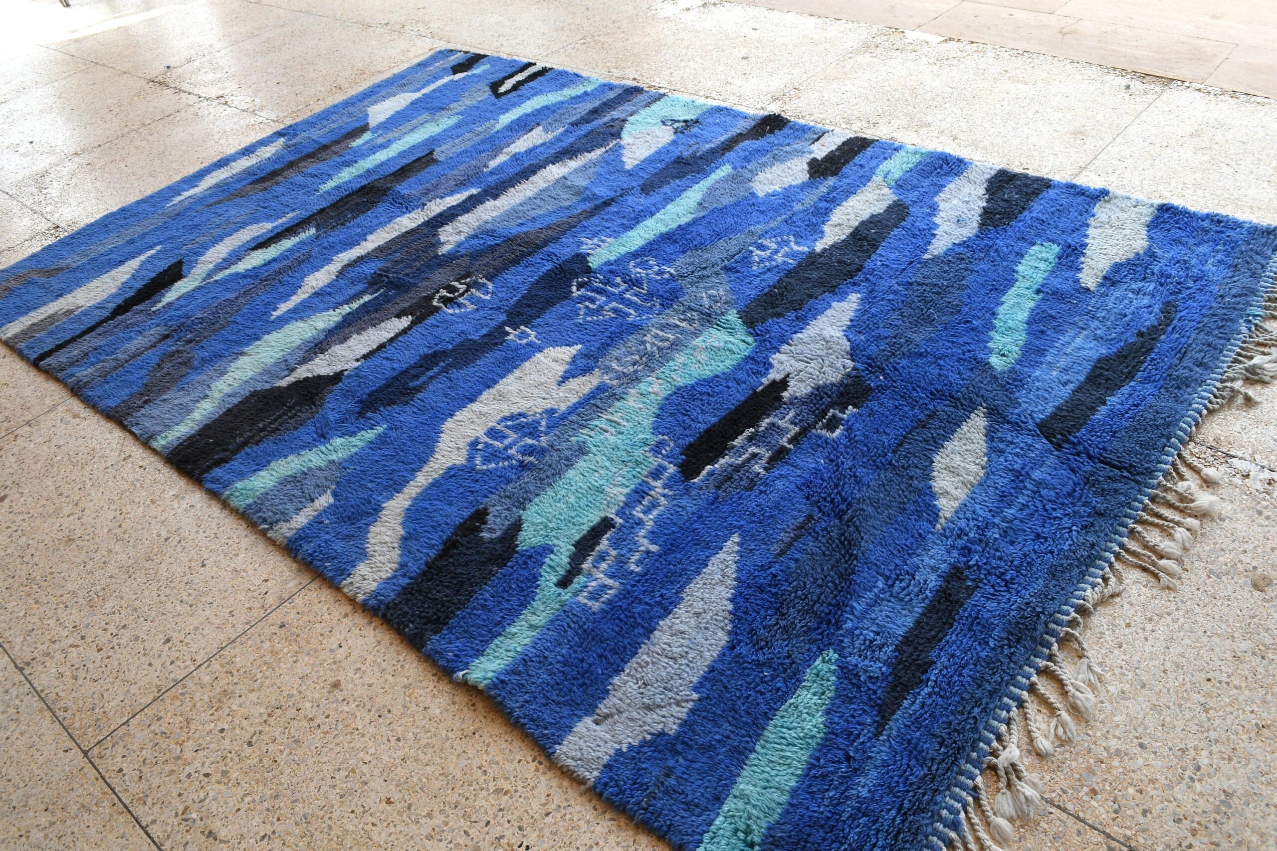 a blue rug with a pattern on it. il_fullxfull.6083093705_lt2e.jpg