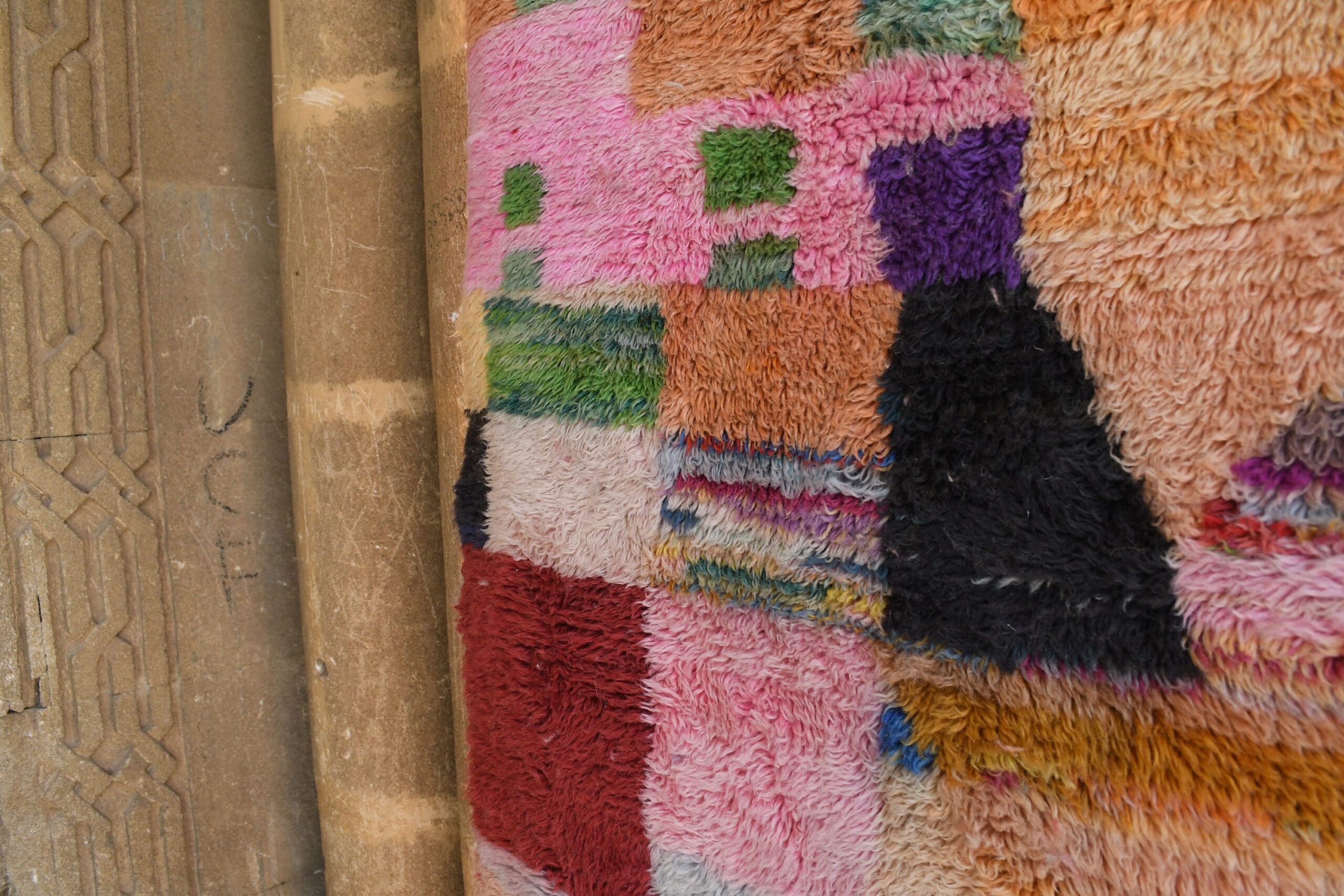 a cat is sitting on a rug on a wooden floor. il_fullxfull.6083105081_99ql.jpg