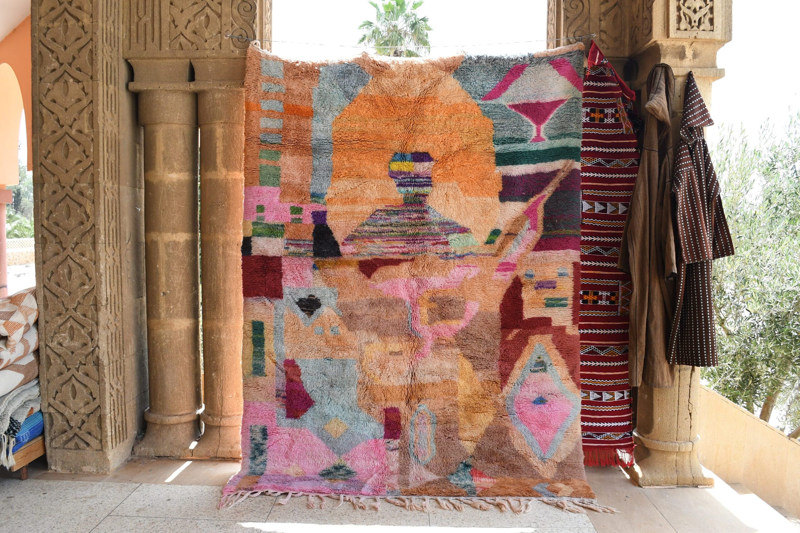 a colorful rug is hanging on a wall. il_fullxfull.6083105995_8ms1.jpg