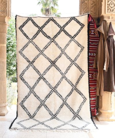 a white and black rug with a pattern on it. il_fullxfull.6083120707_q25q.jpg