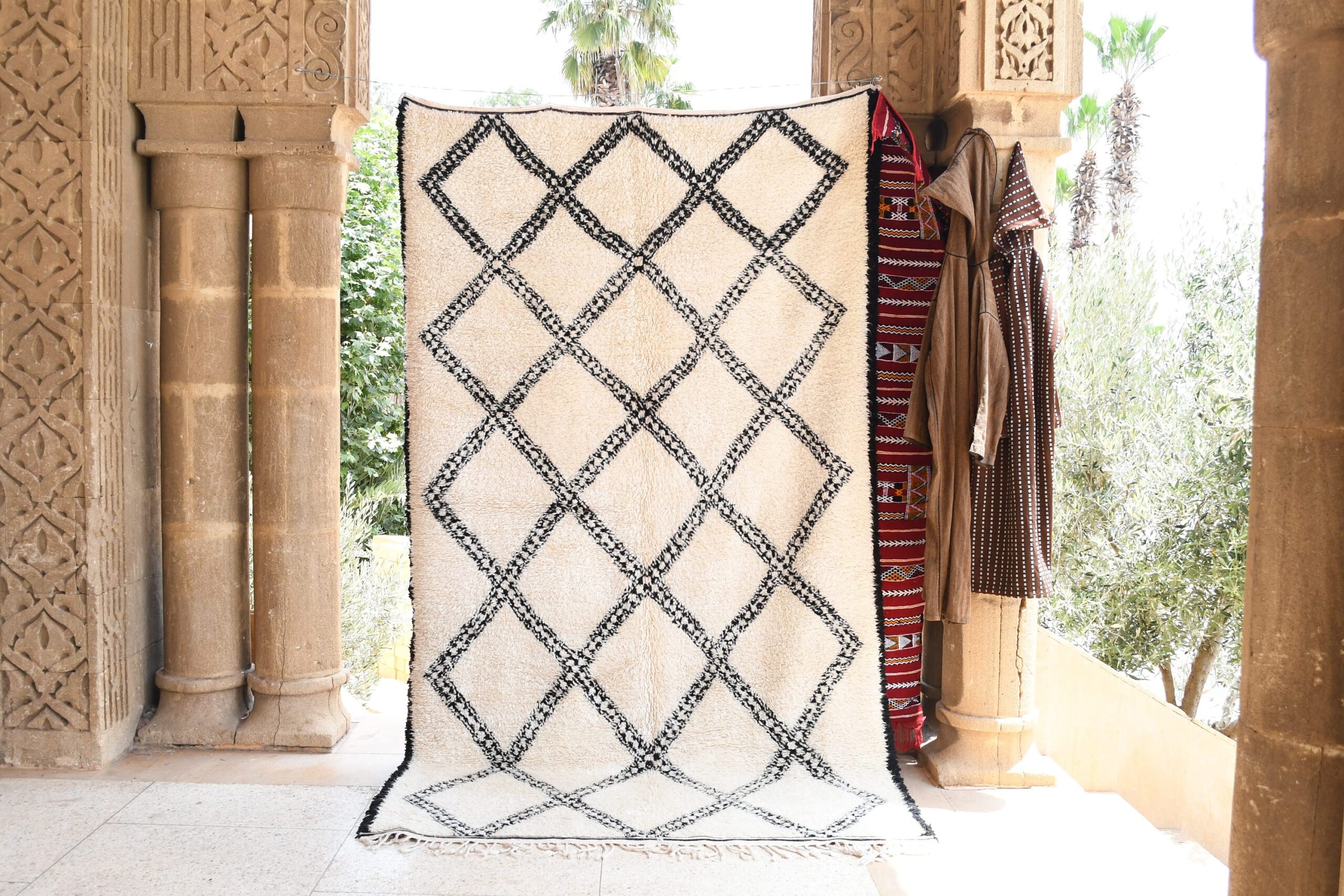 a white and black rug with a pattern on it. il_fullxfull.6083120707_q25q.jpg