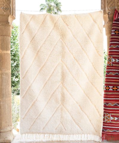 a white moroccan rug hanging on a wall. il_fullxfull.6083126541_36e2.jpg