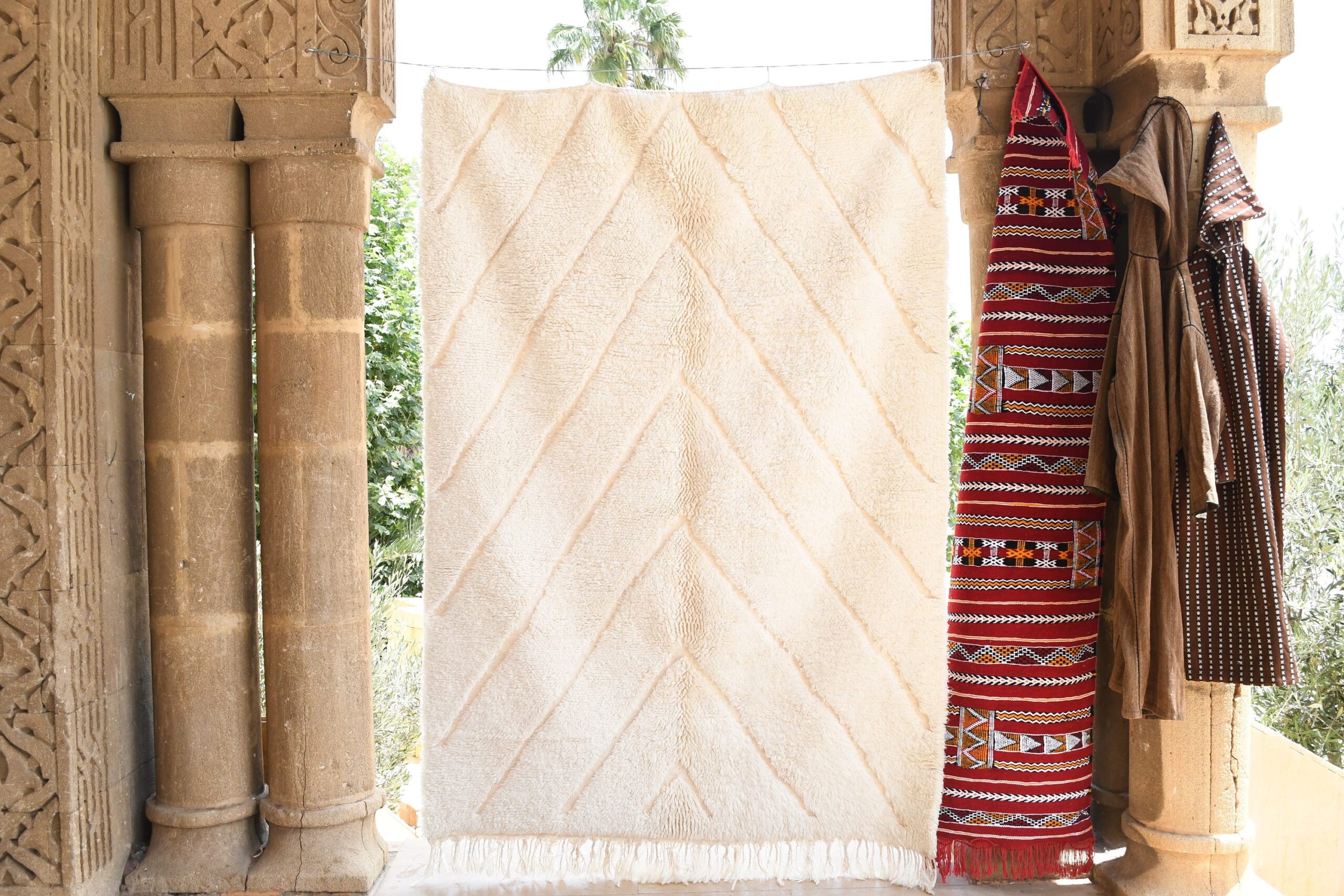 a white moroccan rug hanging on a wall. il_fullxfull.6083126541_36e2.jpg