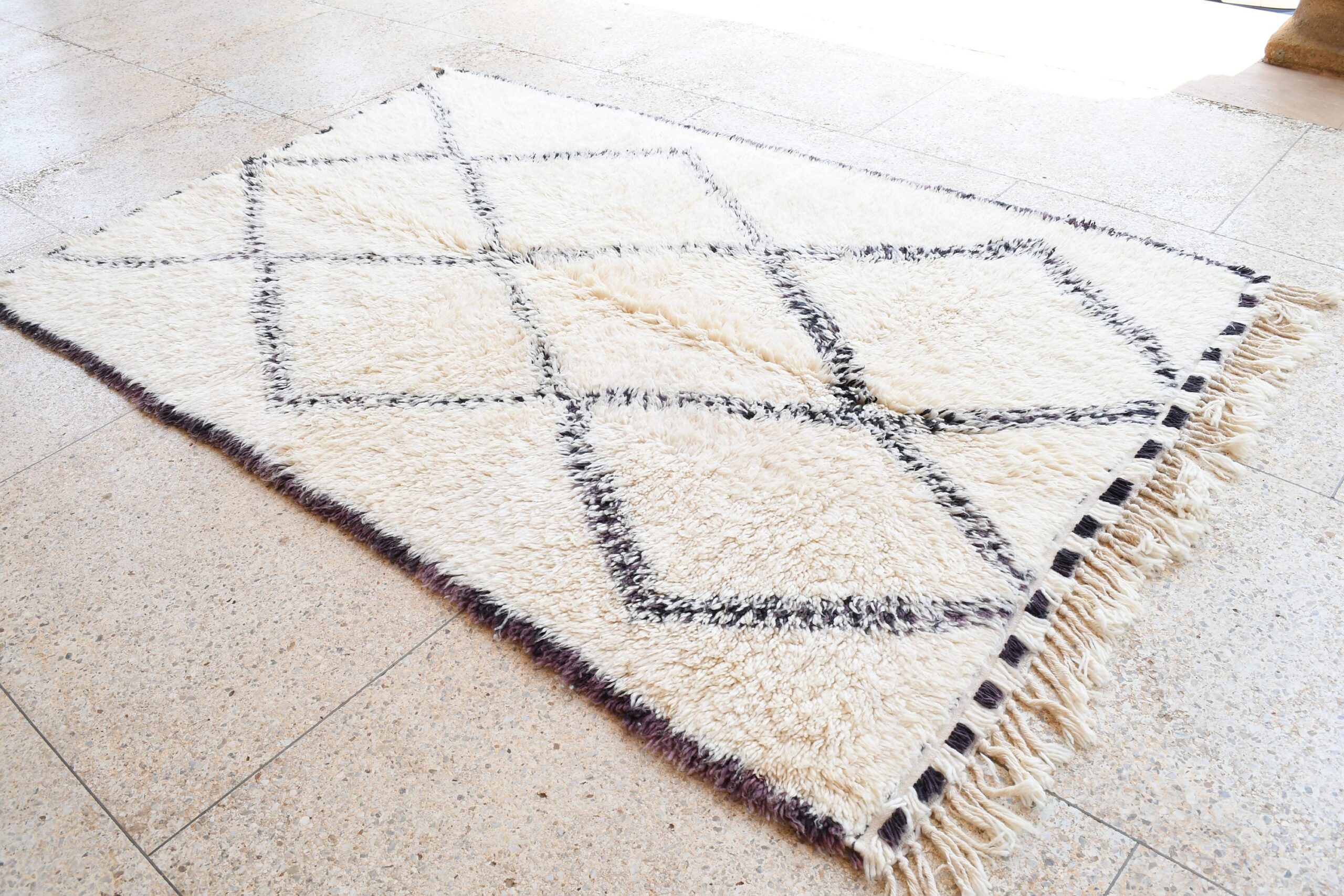 a rug with a black and white pattern. il_fullxfull.6083131969_gvm3.jpg