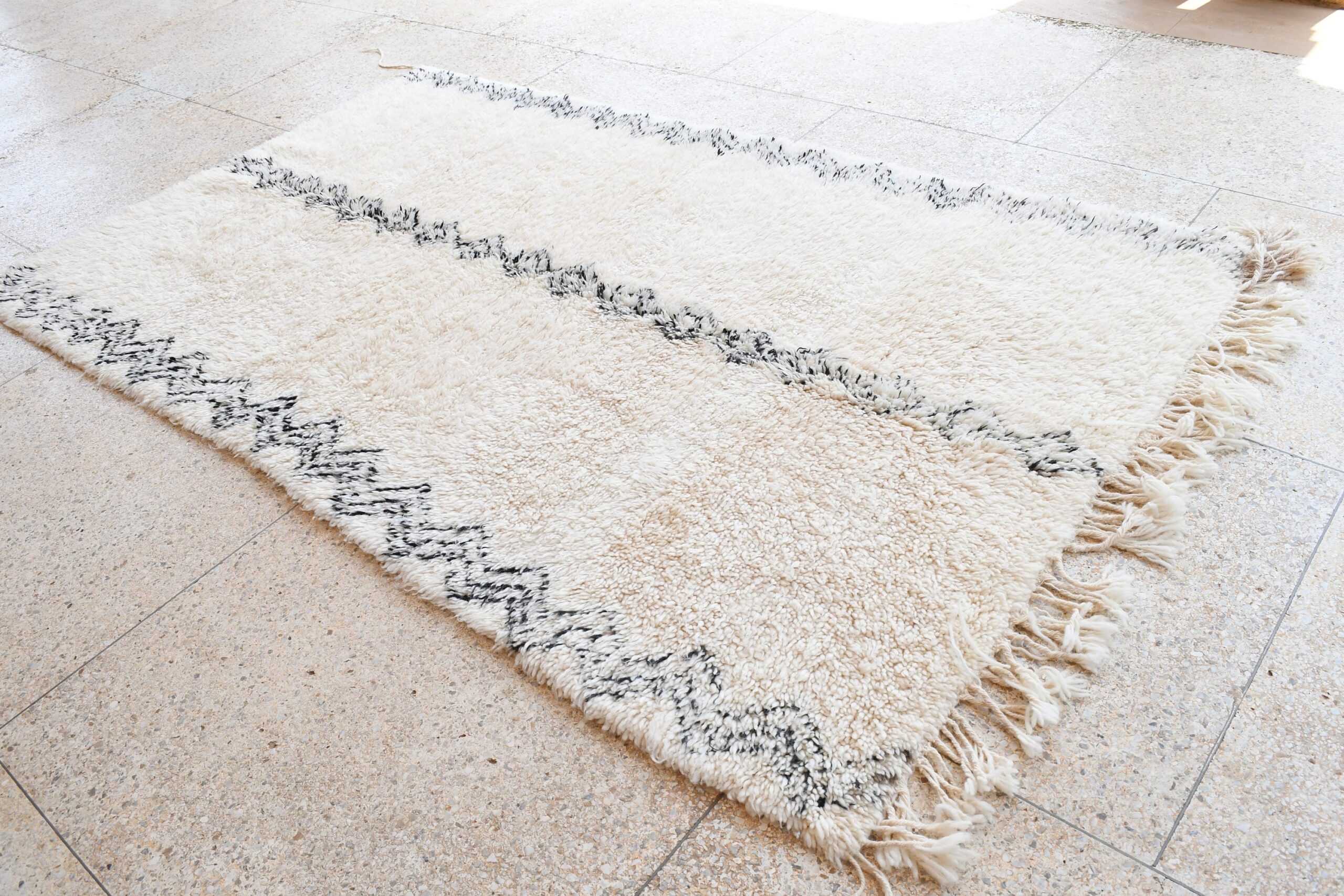 a white rug with black and white stripes. il_fullxfull.6083133349_i7jg.jpg