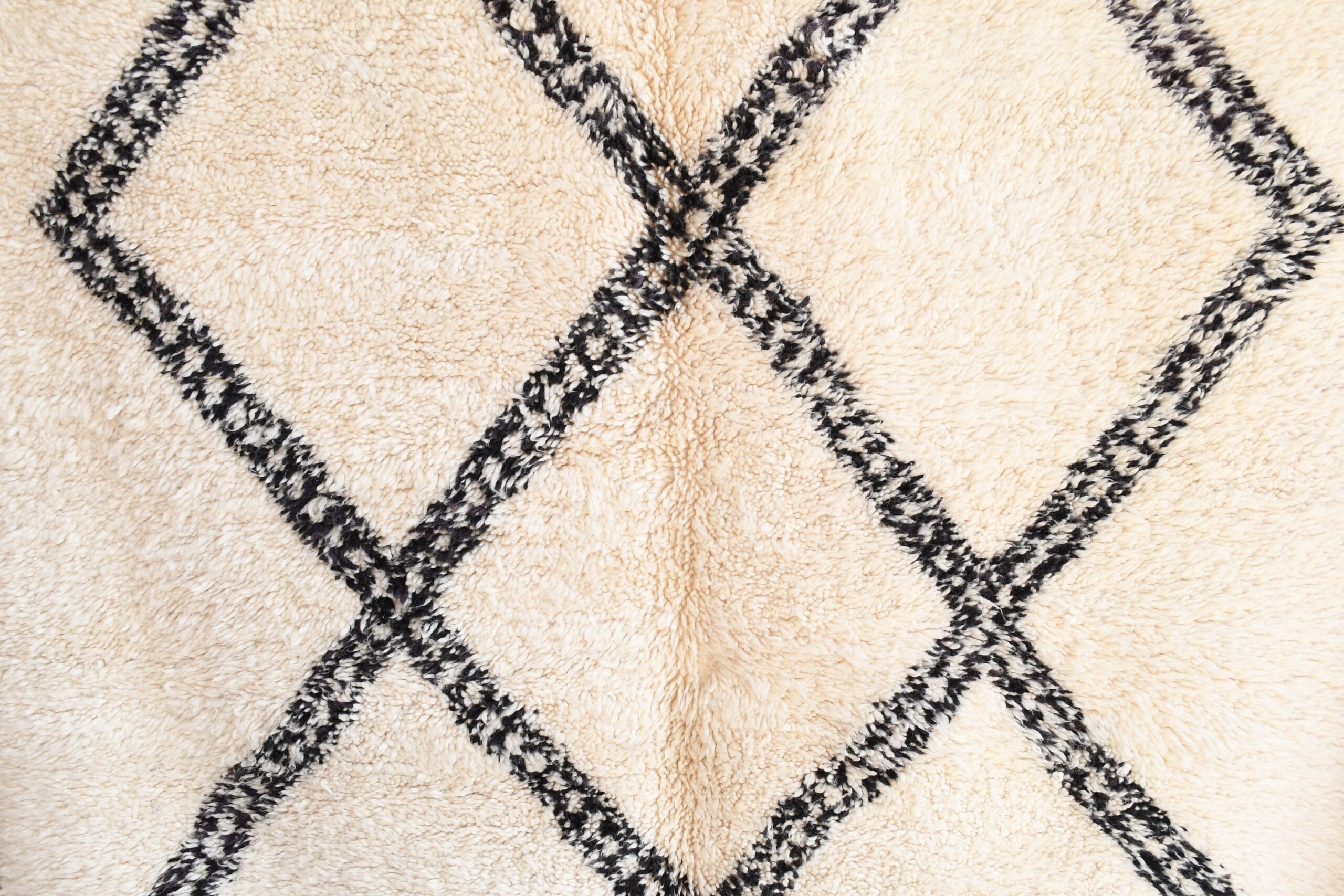 a white and black rug with a diamond pattern. il_fullxfull.6083136211_em2t.jpg