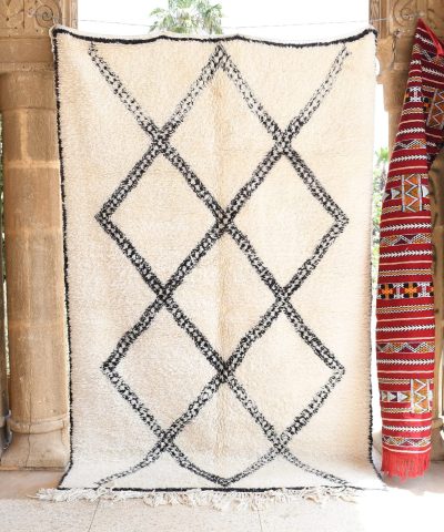 a rug hanging on a wall in a room. il_fullxfull.6083136767_2zsn.jpg