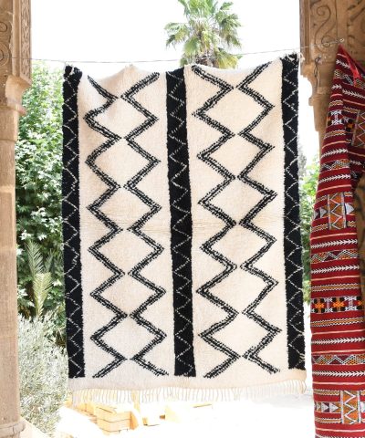 a black and white rug hanging on a wall. il_fullxfull.6083142547_iha0.jpg
