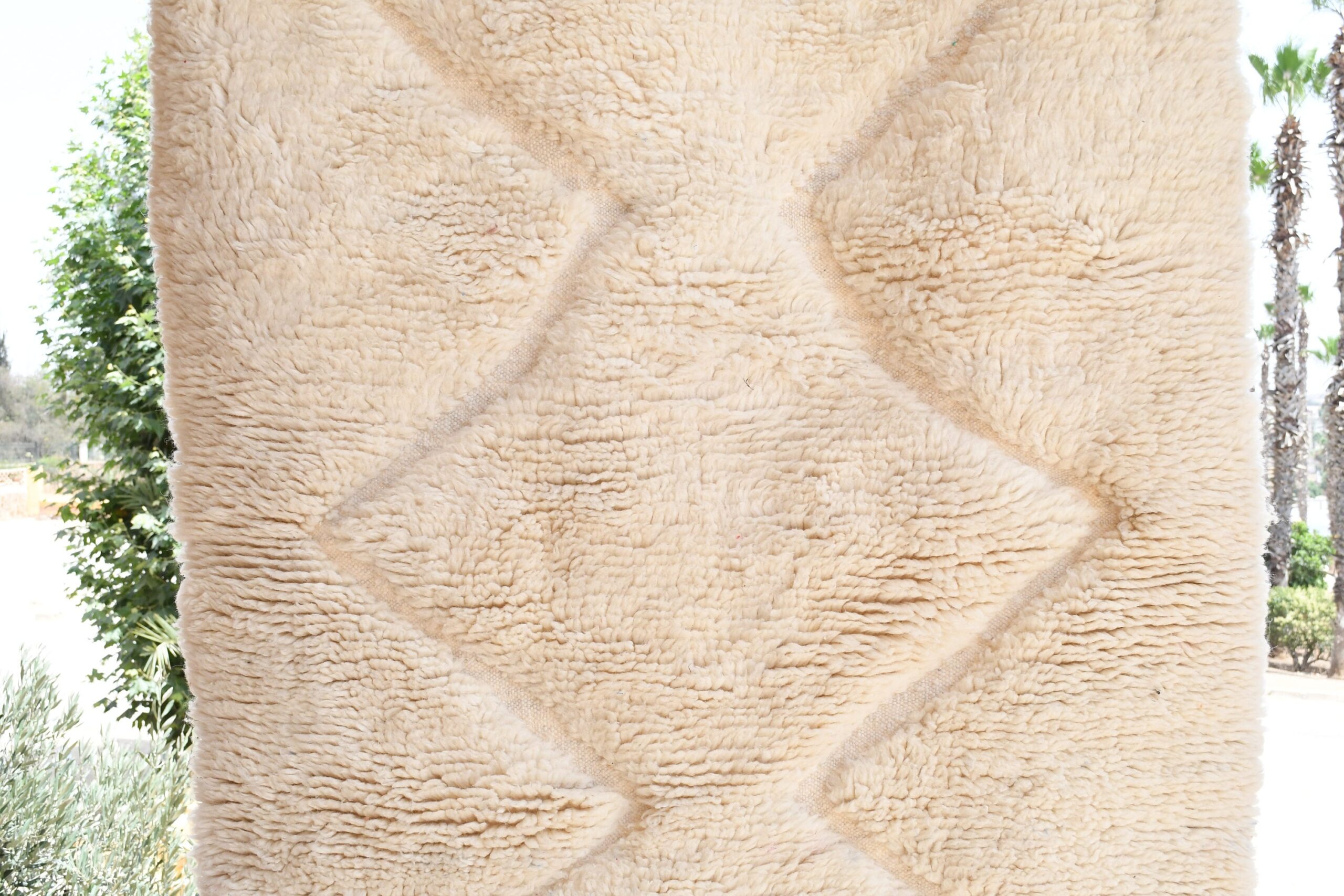 a large white sheep standing next to a tree. il_fullxfull.6083144919_eqrx.jpg