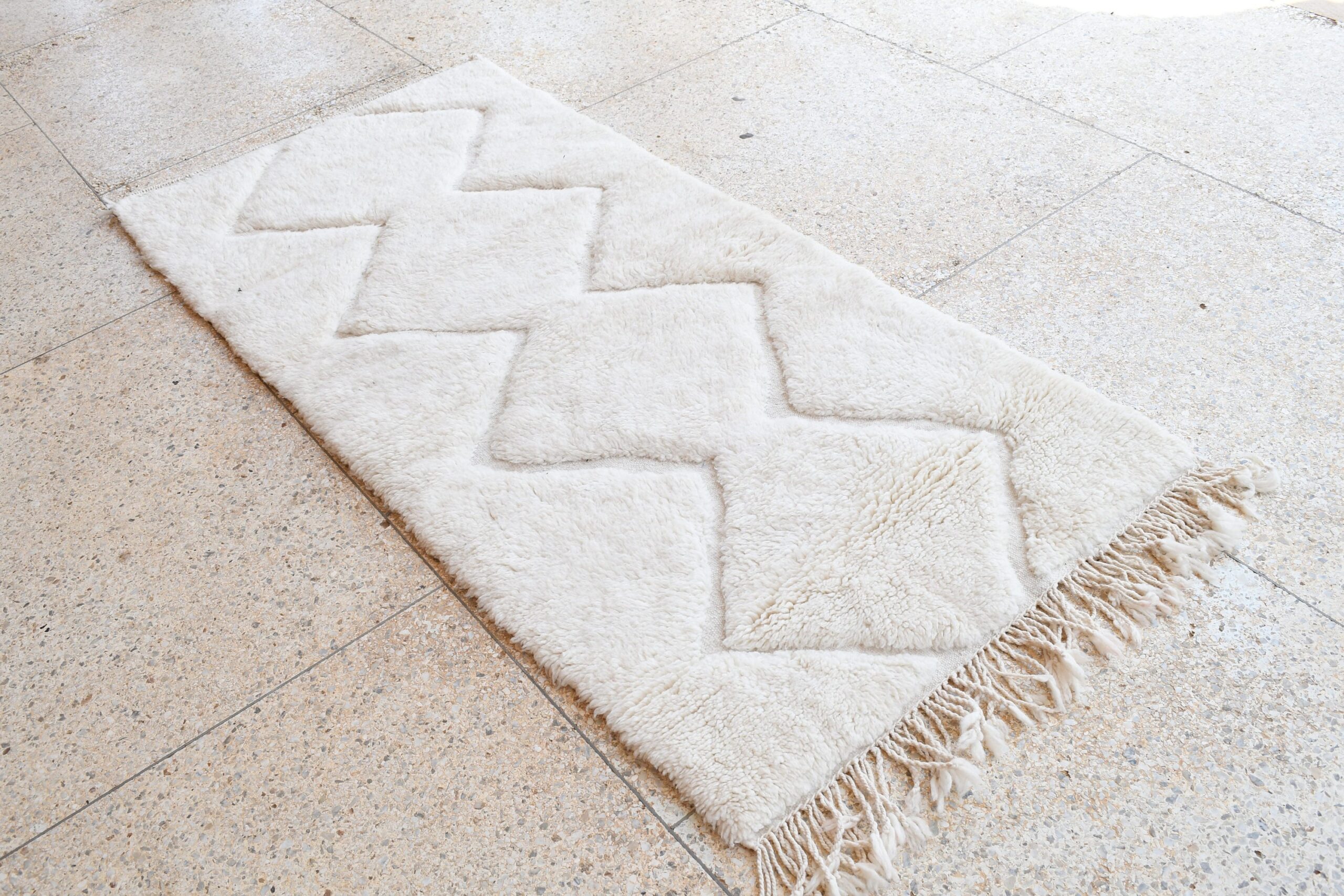 a white rug on the floor. il_fullxfull.6083146511_7jf3.jpg