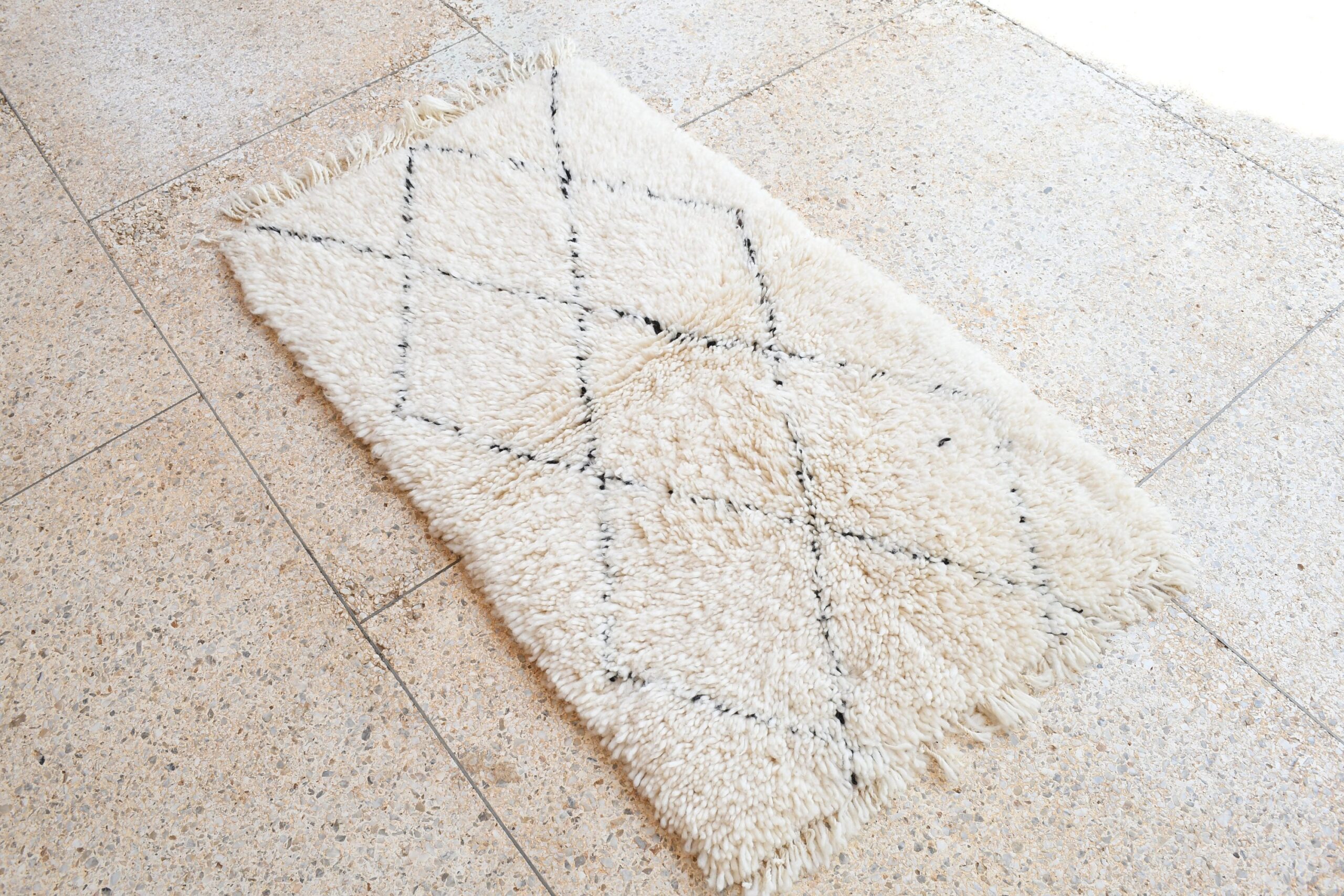 a white rug on the floor. il_fullxfull.6083157181_c1vn.jpg