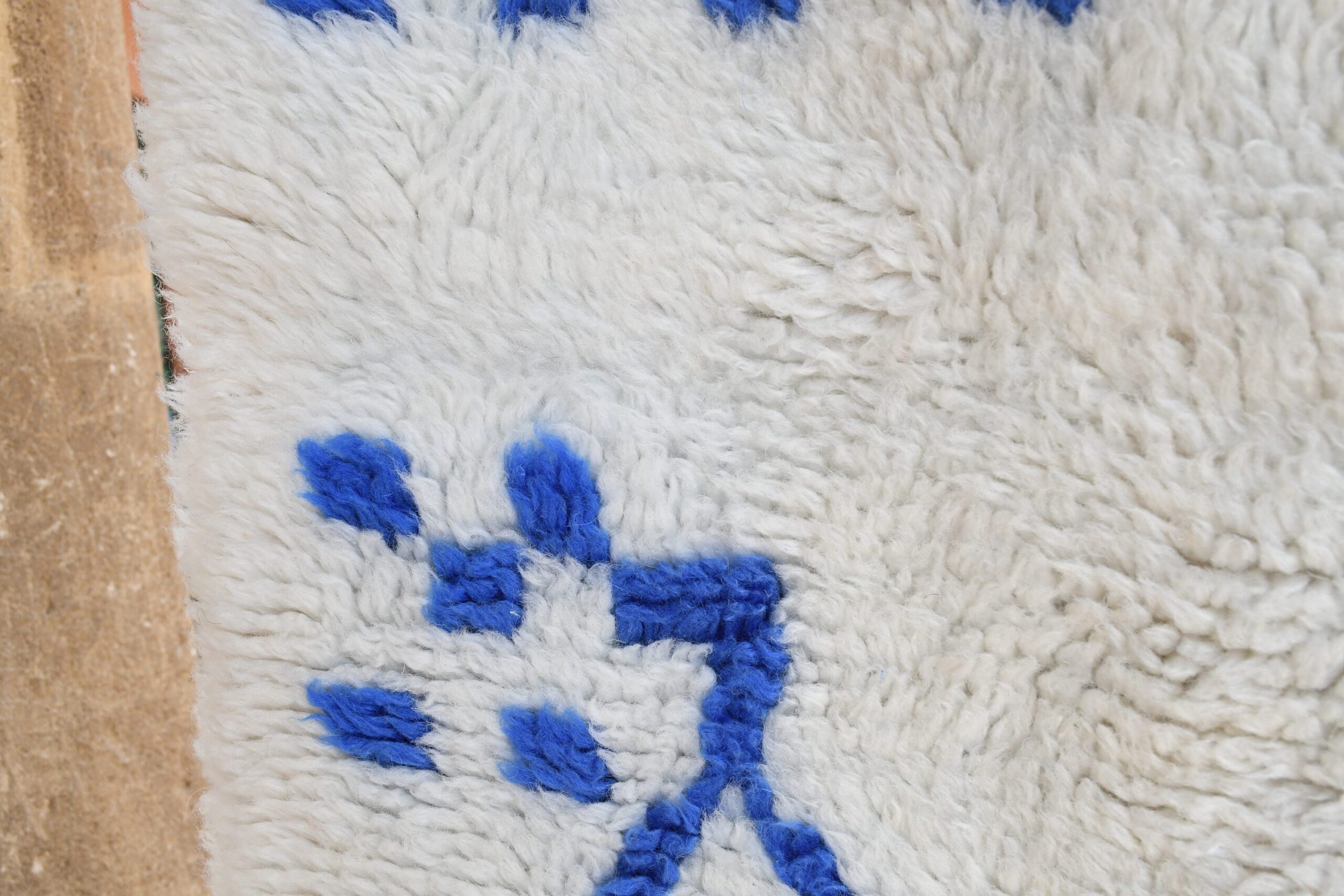 a white sheep with blue spots laying on a rug. il_fullxfull.6083158397_mnq8.jpg