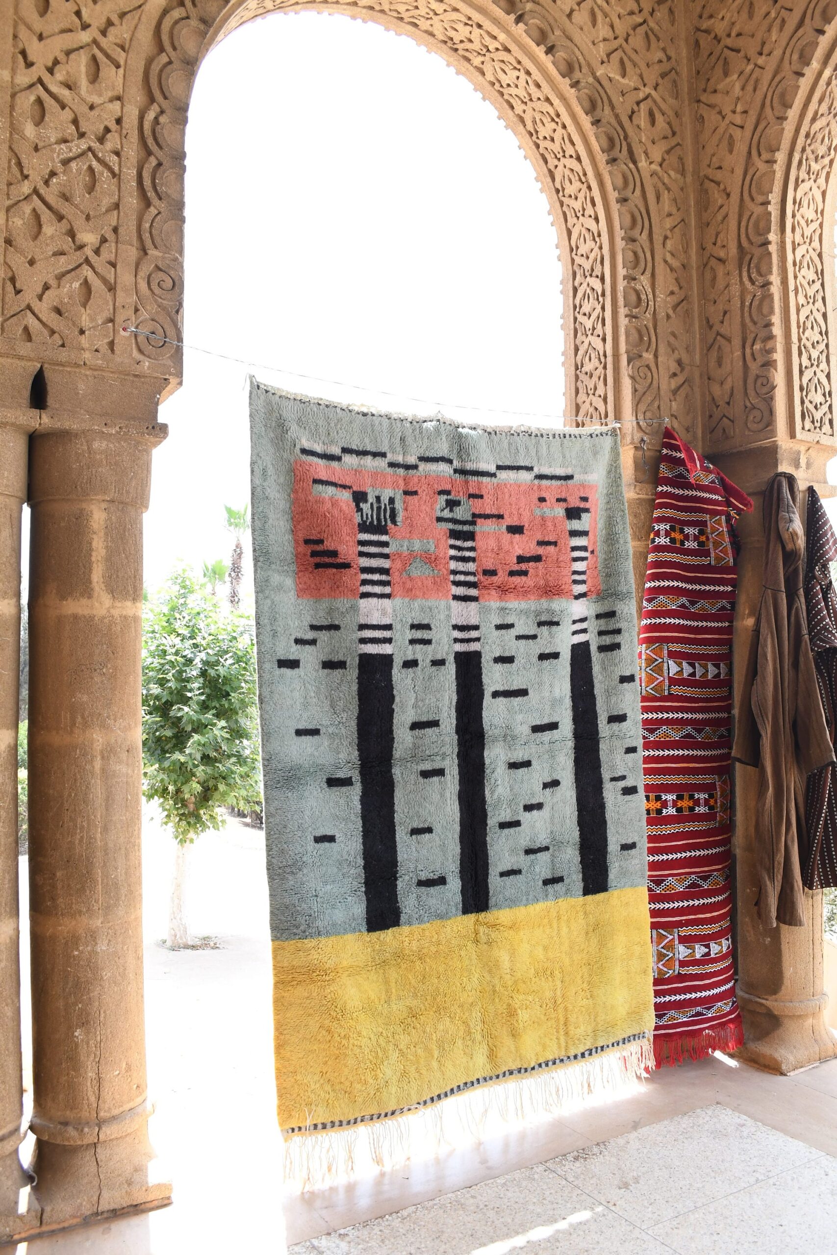 a rug hanging on a wall in a room. il_fullxfull.6084533363_slrl.jpg