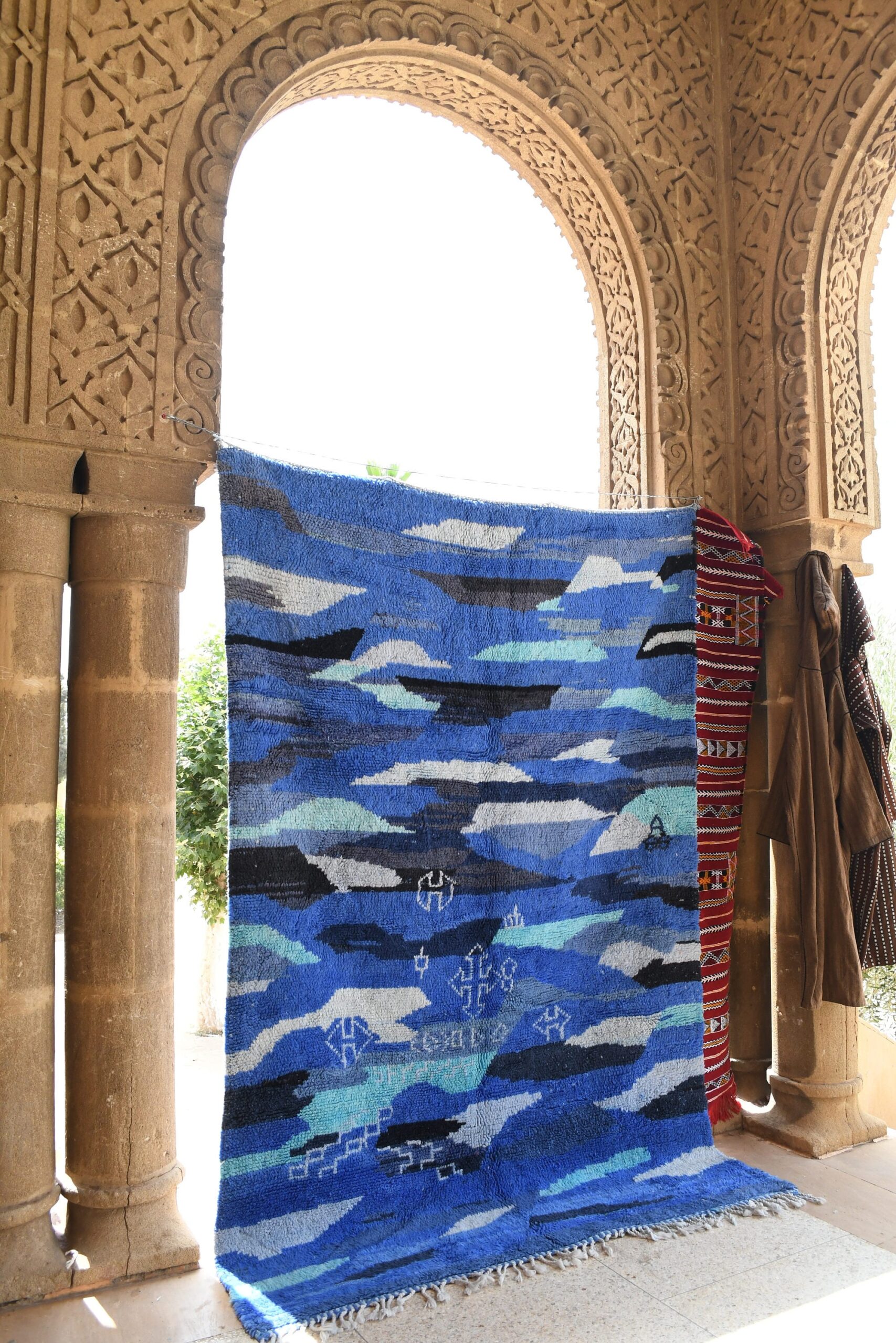 a blue rug with a blue and white design. il_fullxfull.6084564861_6gng.jpg