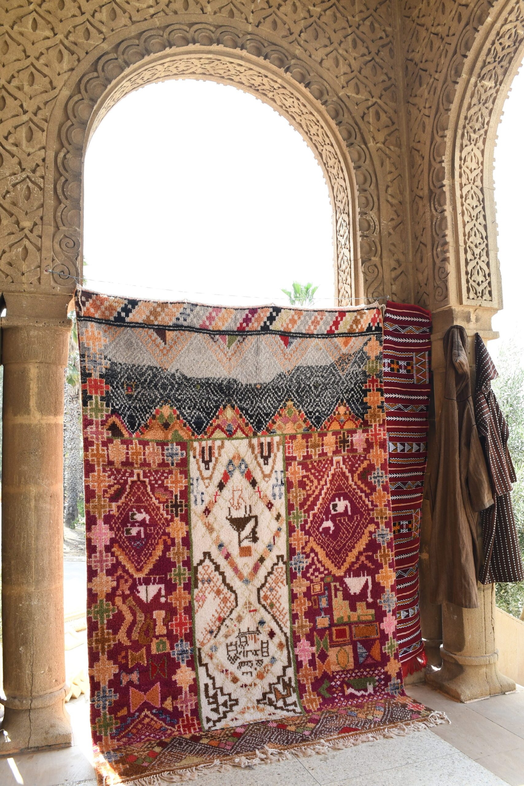 a colorful rug is on display in a building. il_fullxfull.6084586041_l0c0.jpg